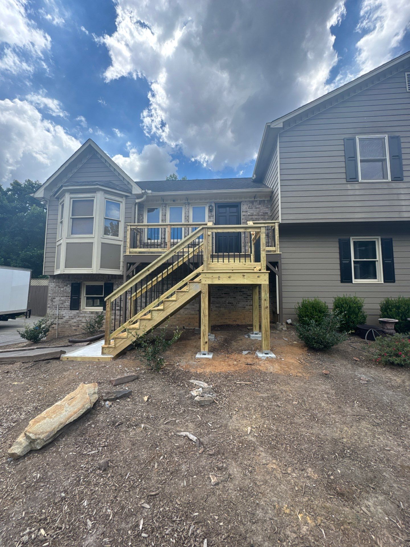 Elevated Pressure-Treated Deck and Staircase Build in Powder Springs by Swift Home Renovations
