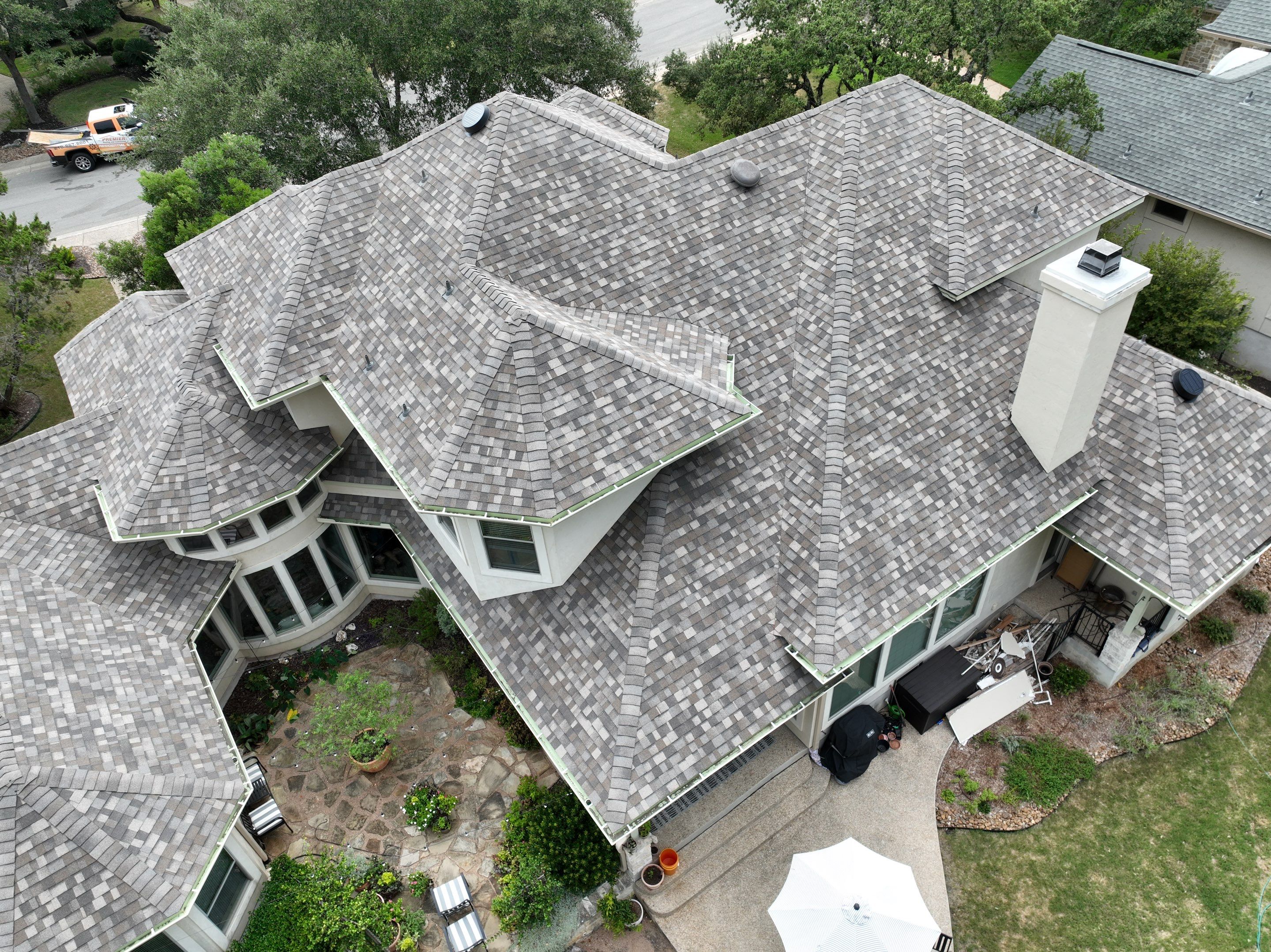 Residential Roof Replacement using 30 Year Laminate Shingles with High Profile Ridge by Premier Roofing and Contracting