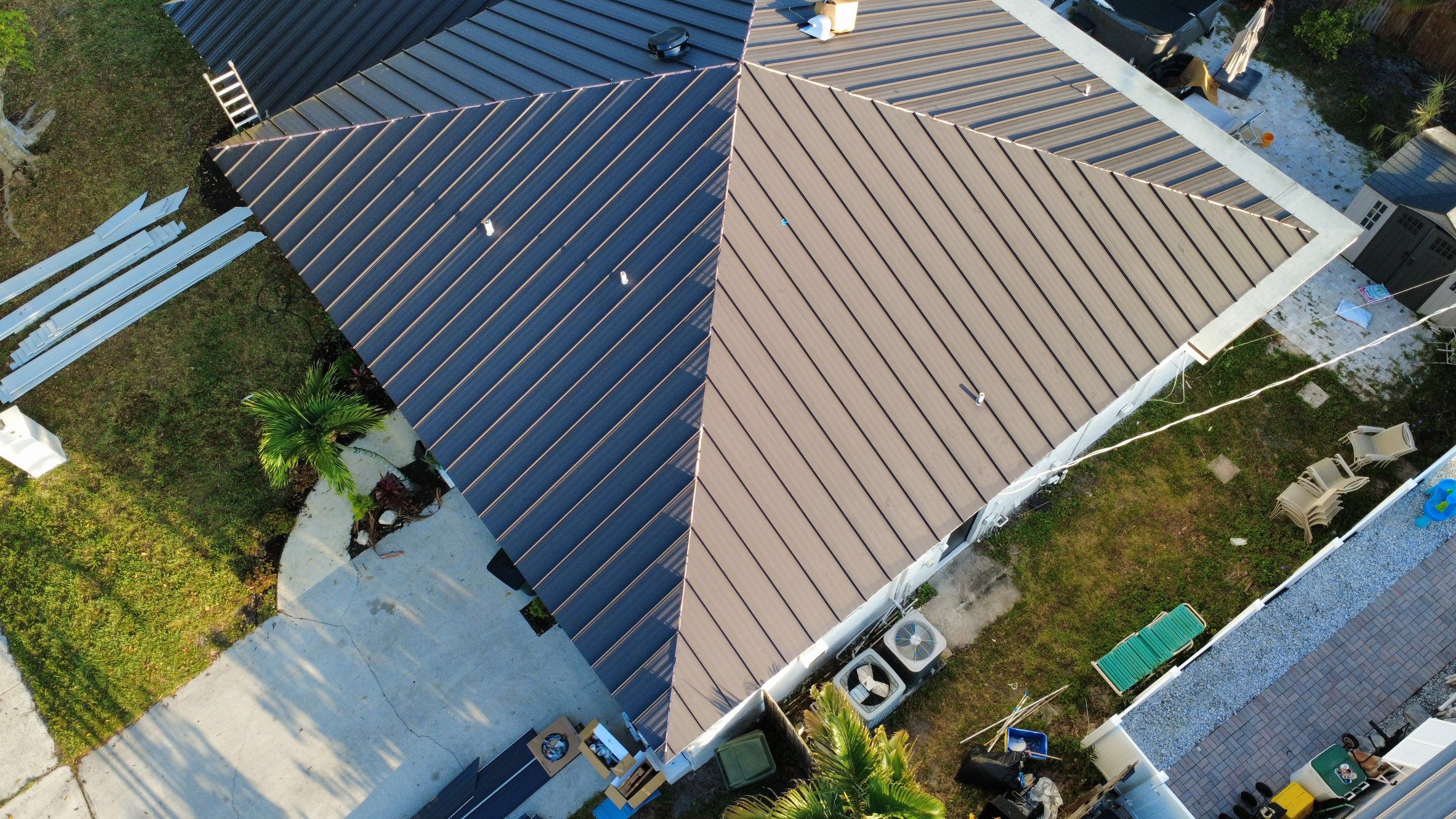 Residential Roofing Installation using 1.5'' Mechanical Seam by BLUES BROTHERS ROOFING