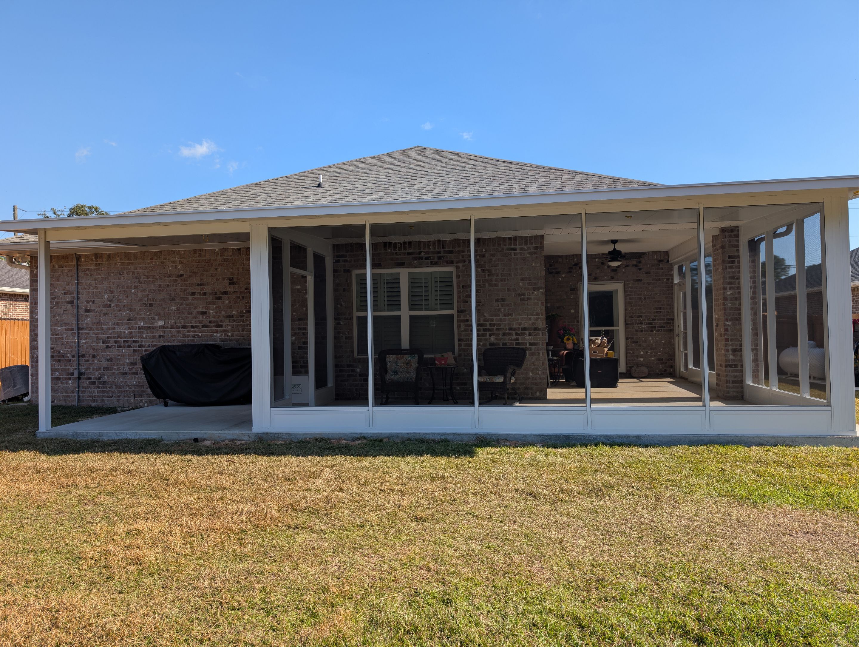 Home addition w/Vinyl 4-Track Windows by Titan Sunrooms