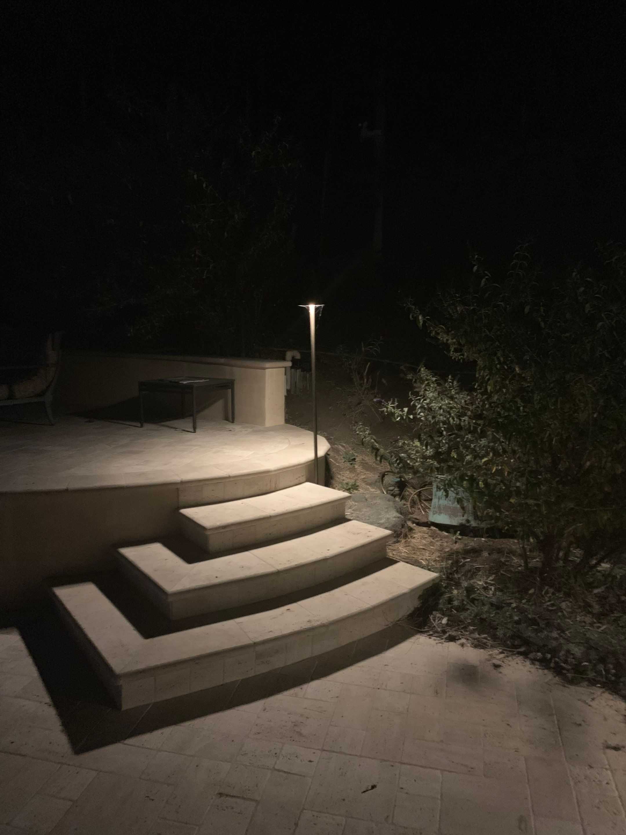 Malibu Hillside Outdoor Living Space with Custom Landscape Lighting + Surround Sound System by Outdoor Lights + Shades