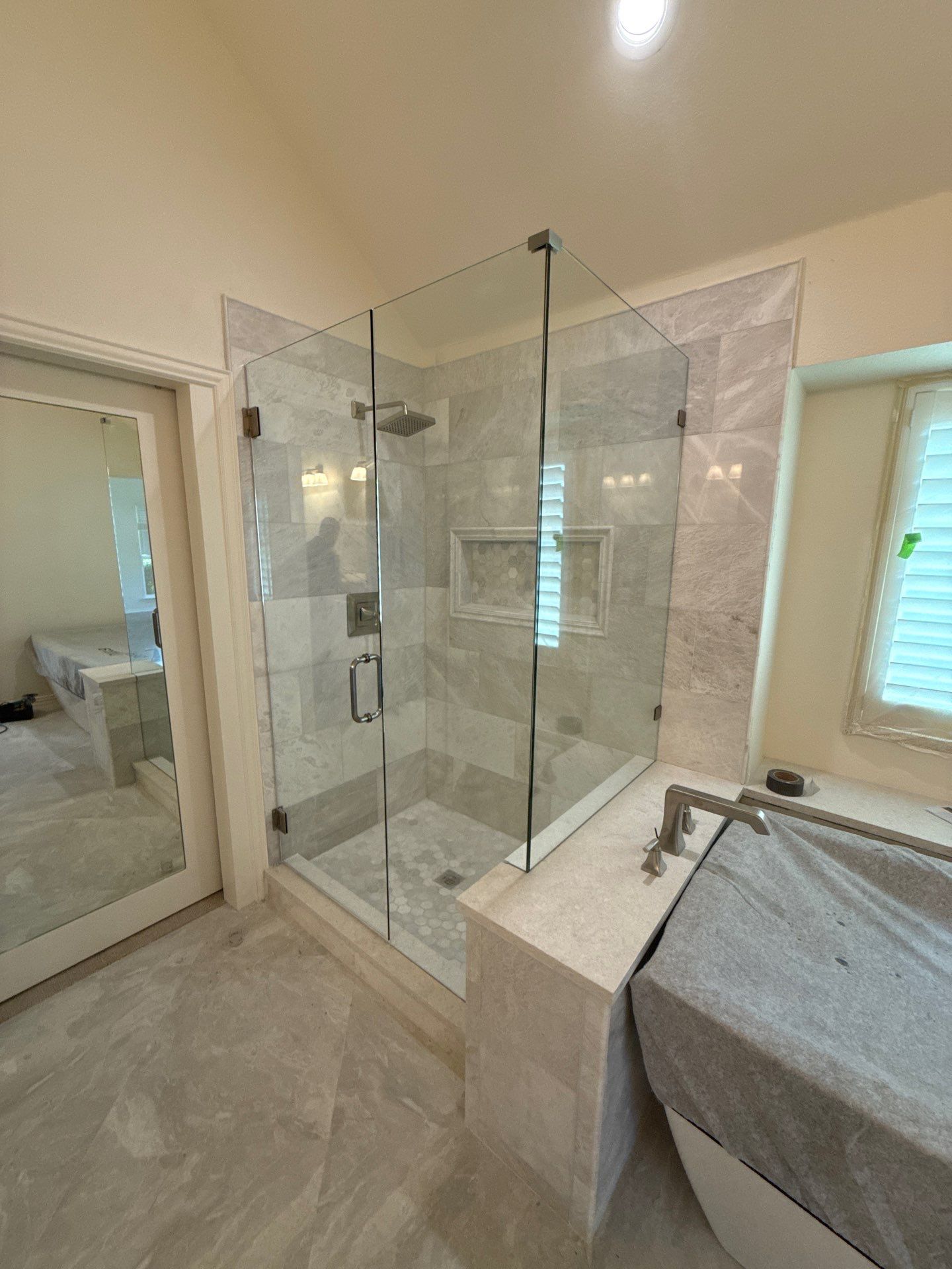 Frameless Shower and Mirror for Closet Applied to Pocket Door by Richardson Glass & Mirror
