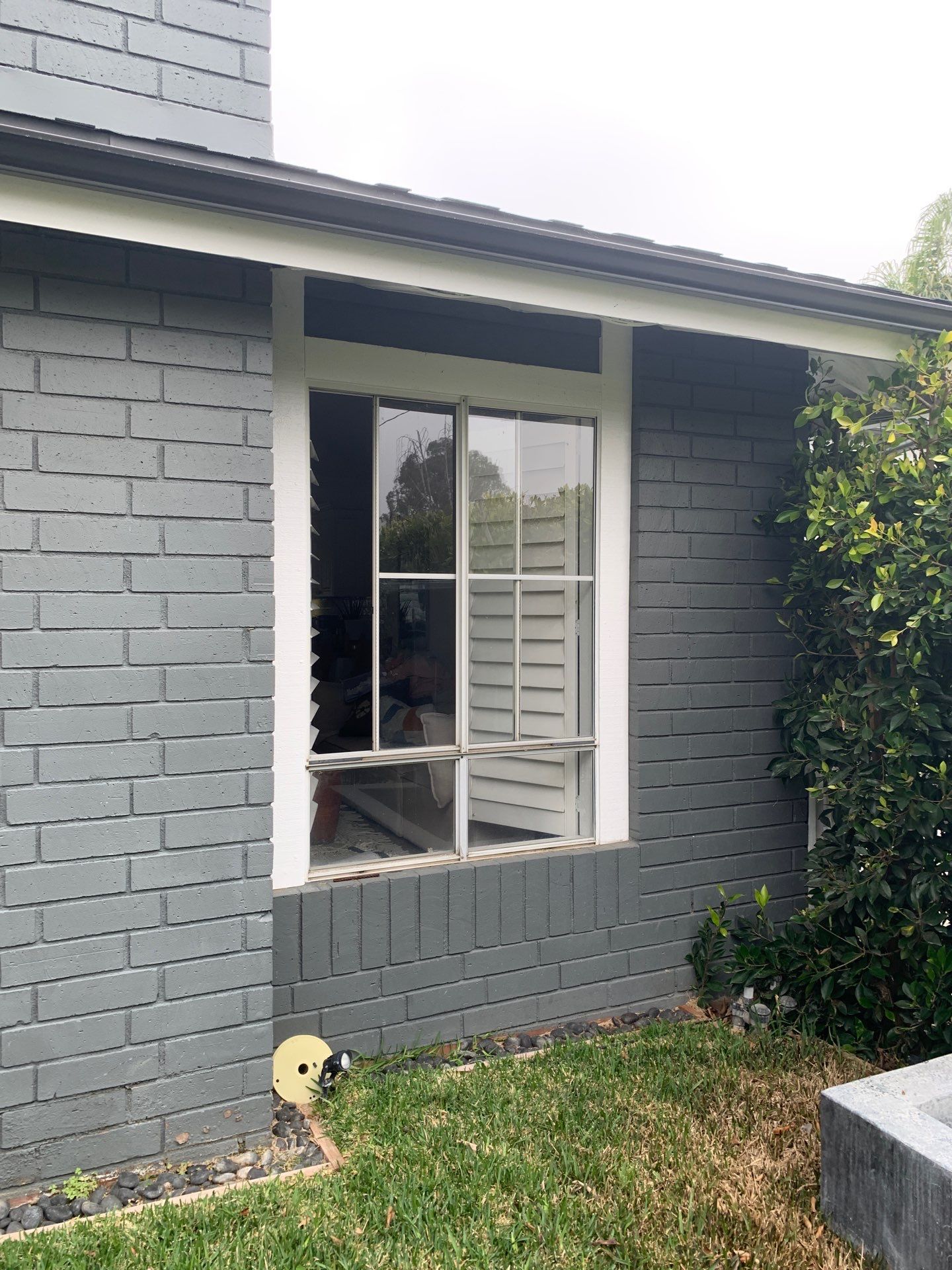 Window Installation using Milgard black vinyl windows by American Window Company