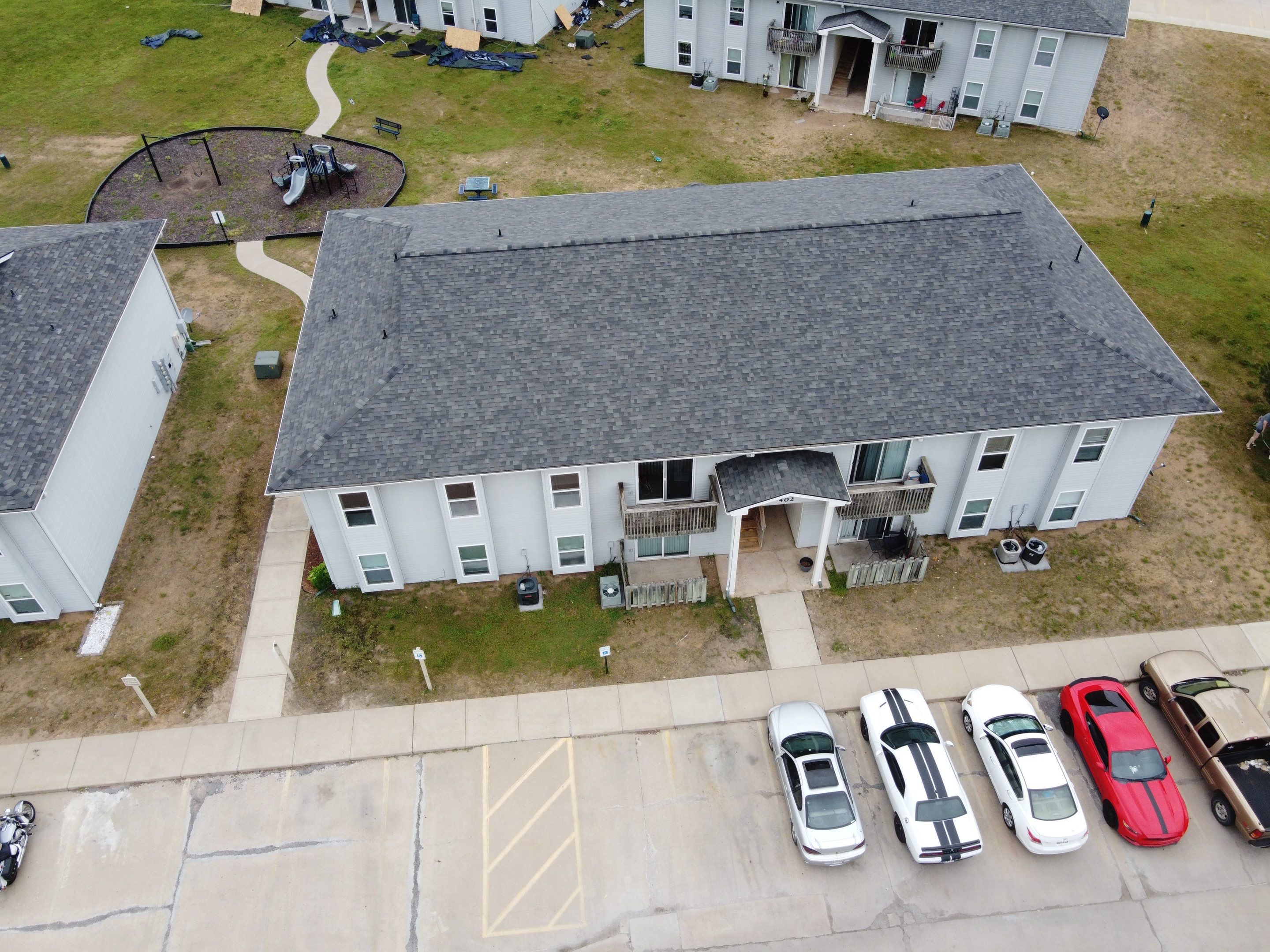 Multifamliy Complex ROOF REPLACEMNT with Ventilation Upgrades using Malarkey Vista Class III IR Shingles by Gorilla Exteriors Contracting, LLC