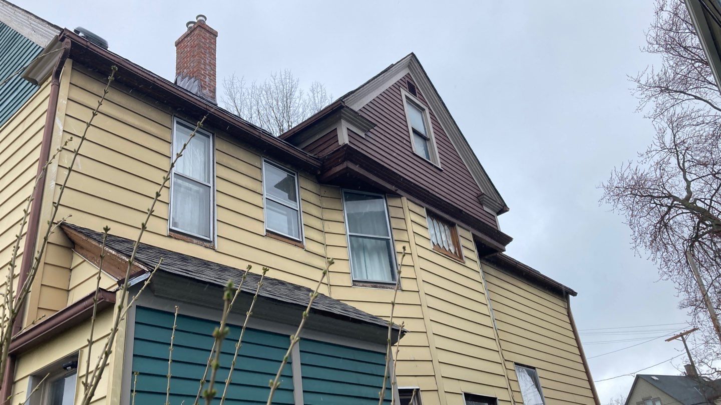 James Hardie Siding on Antique Home by Absolute Roofing and Construction