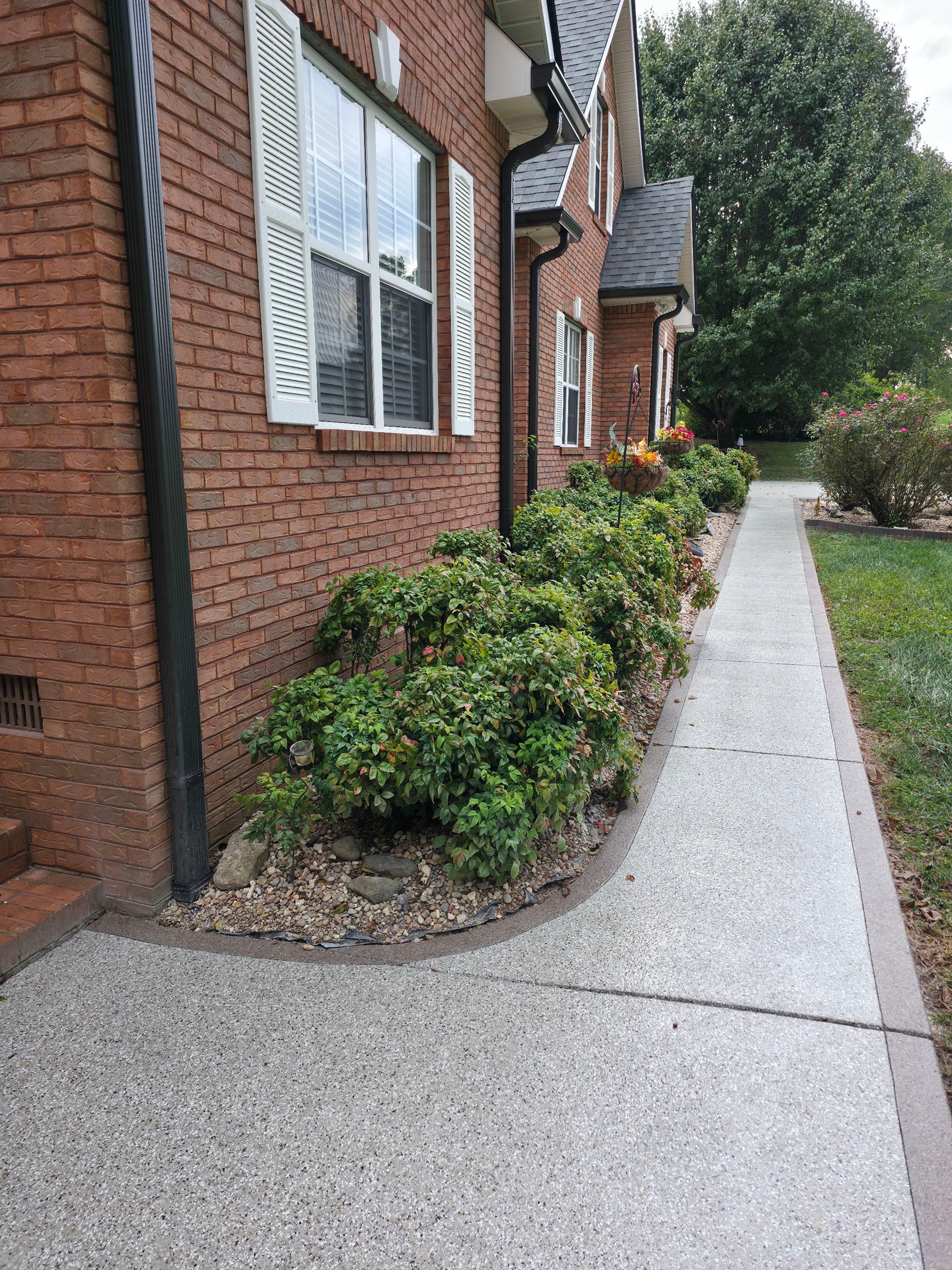Driveway Using Creekbed and Garnet by Elite Floor Solutions