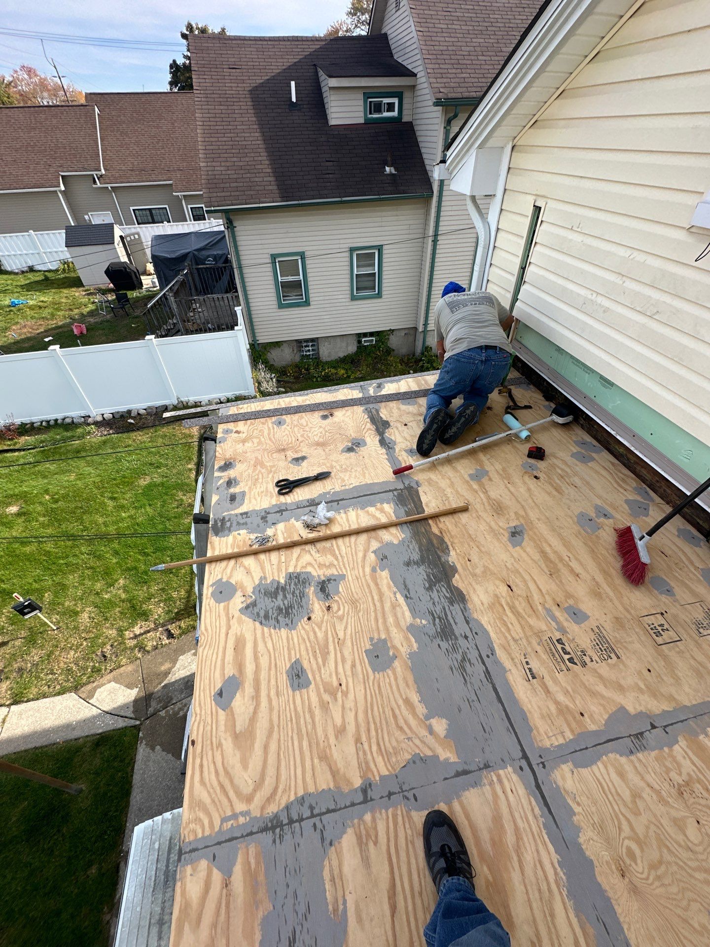 Rebuild balcony flat roofing TREX decking stairway and Railings in Wyandotte, MI by Northwest Construction 