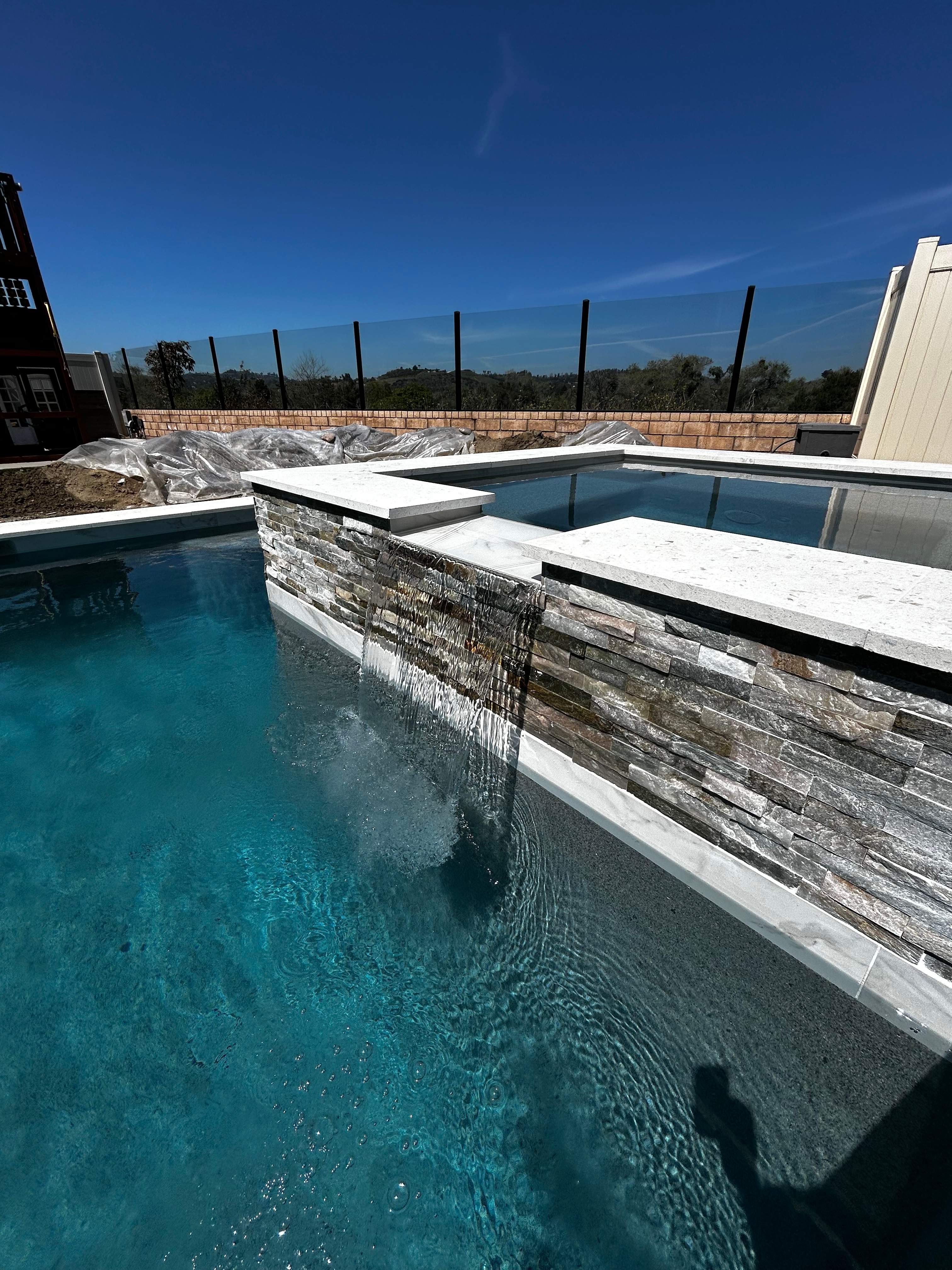Beautiful pool and spa with water feature by Premier Pools and Spas Temecula