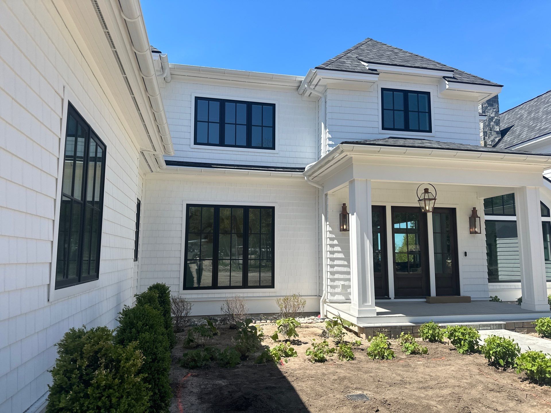 Gutter System and Exterior Drainage Installation in Charlevoix by Rainbow Seamless Systems