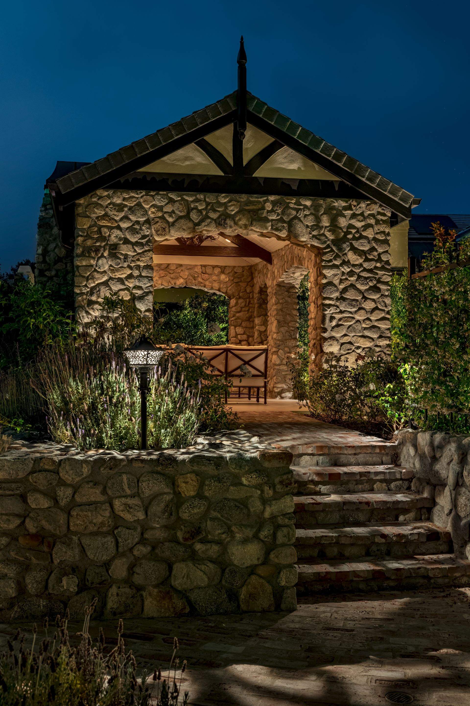 Tudor Estate Landscape Lighting with Integrated Stone Step Illumination by Outdoor Lights + Shades