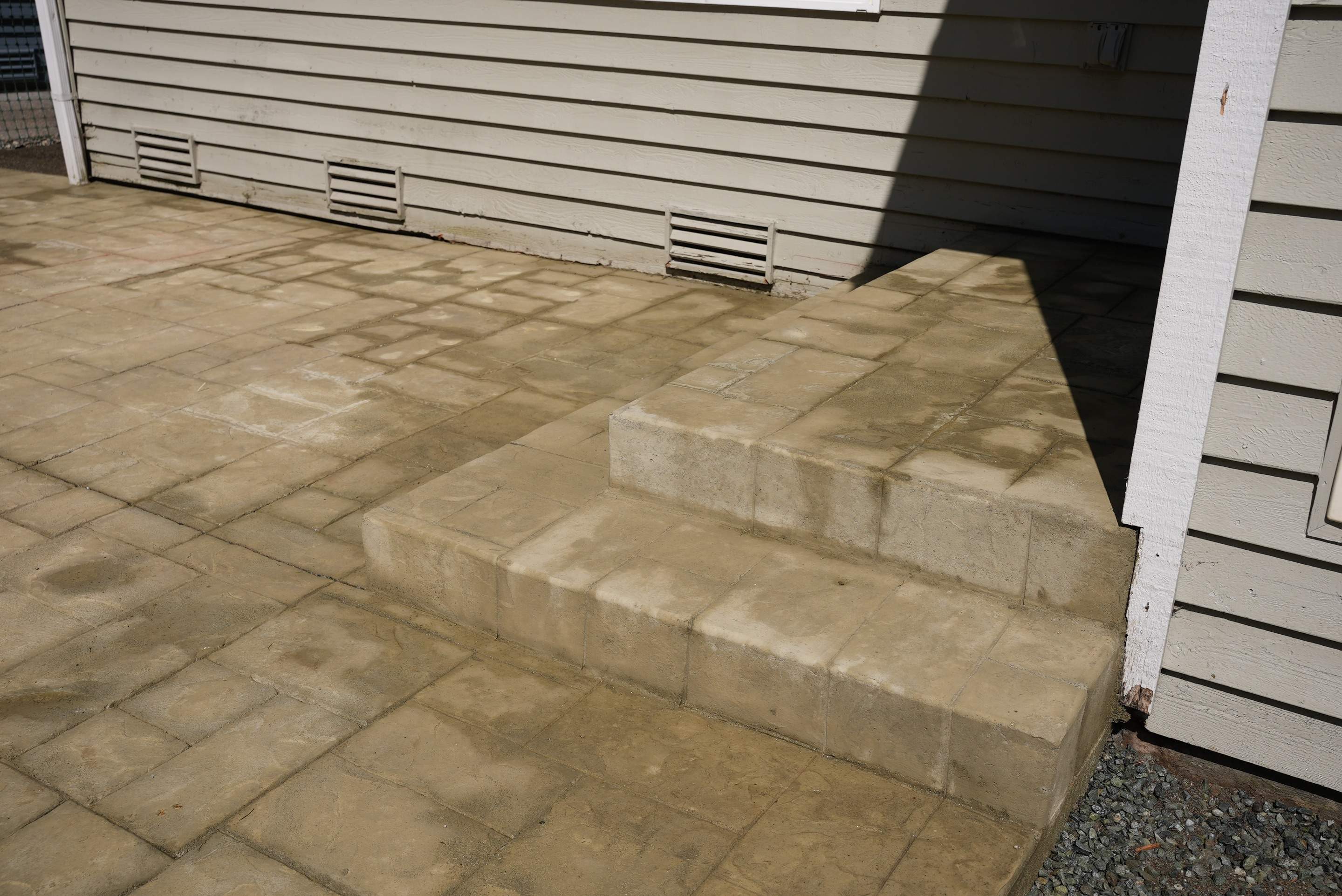 Benedict | Stamped Concrete Back Patio by Jireh Asphalt & Concrete Inc 