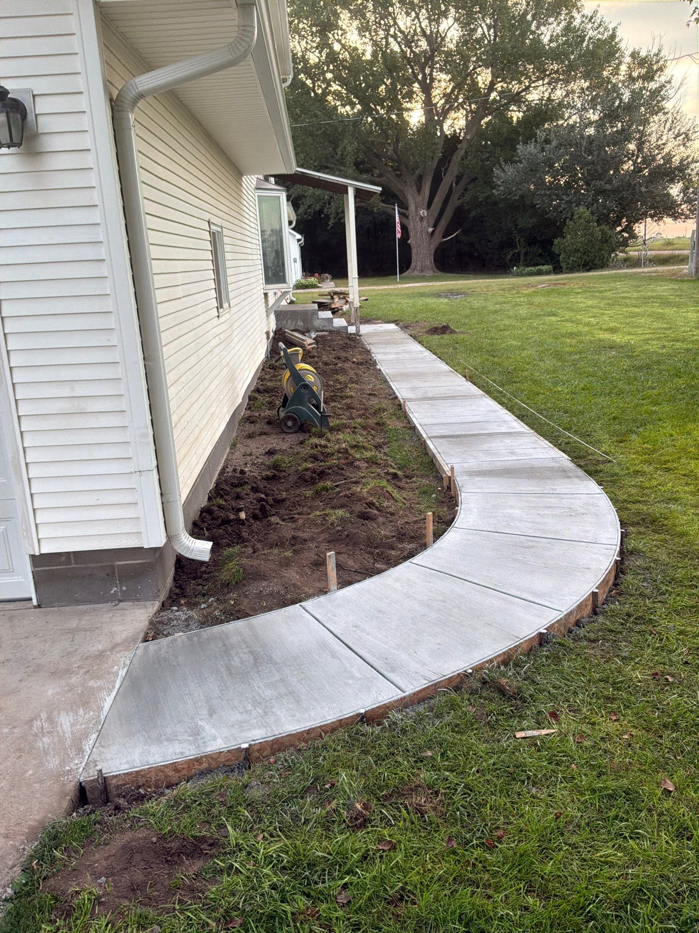 New Concrete Sidewalk, Steps & Railing in Kearney by Loyal Nine