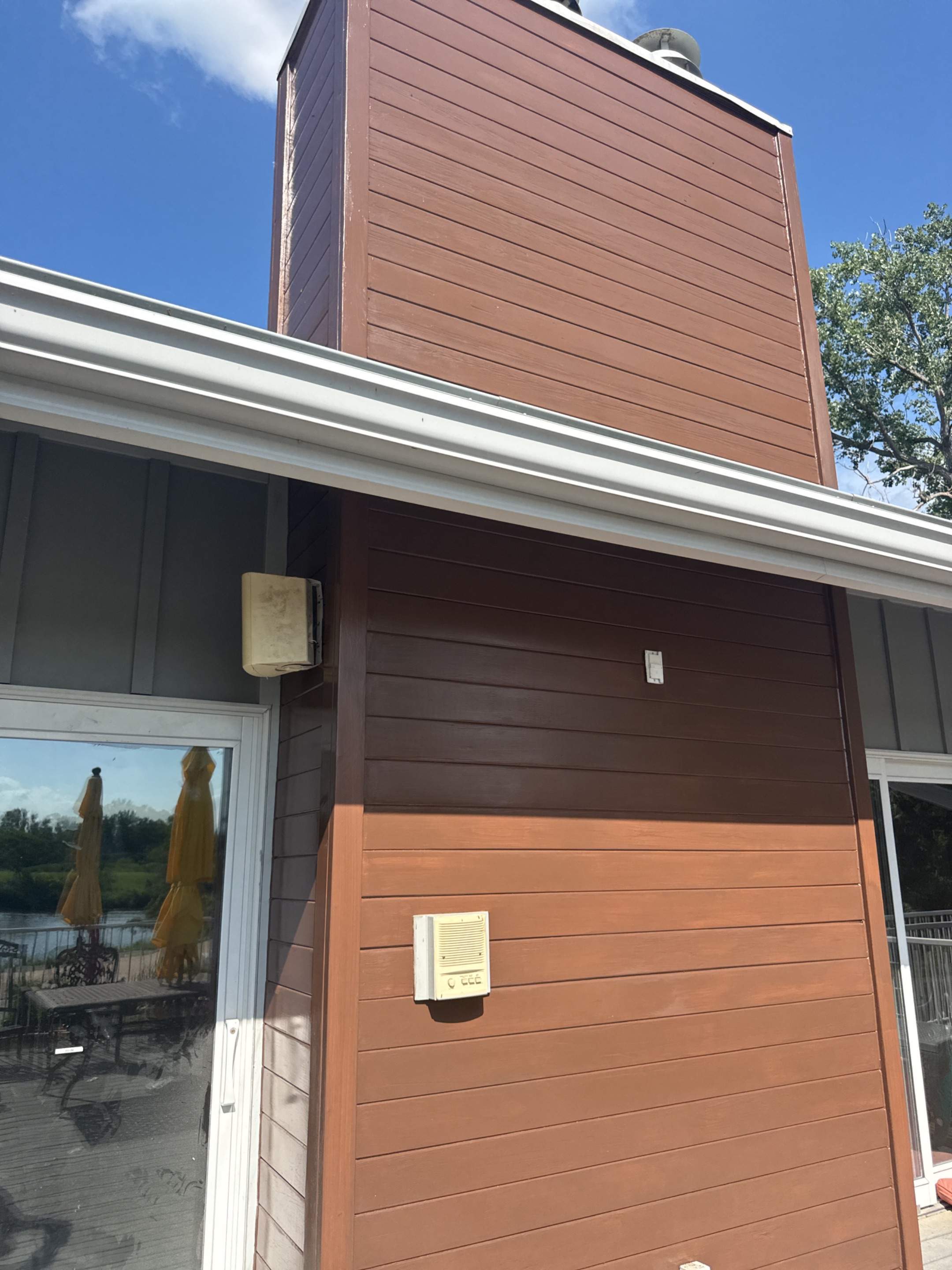 Exterior Wood Siding Staining and Chimney Refinishing in Valley by Carps Complete Exteriors