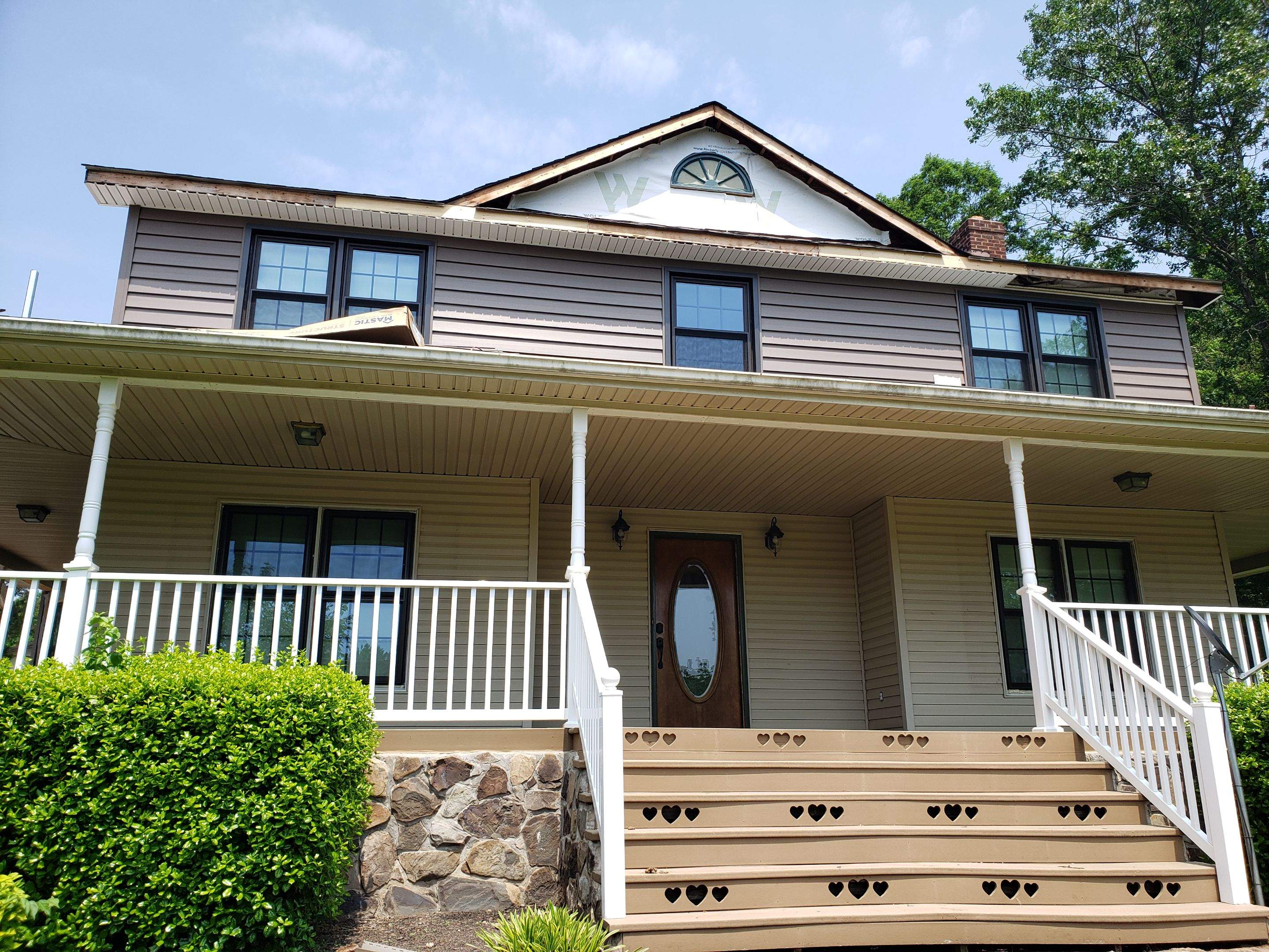 Exterior remodel including window replacement by American Home Contractors