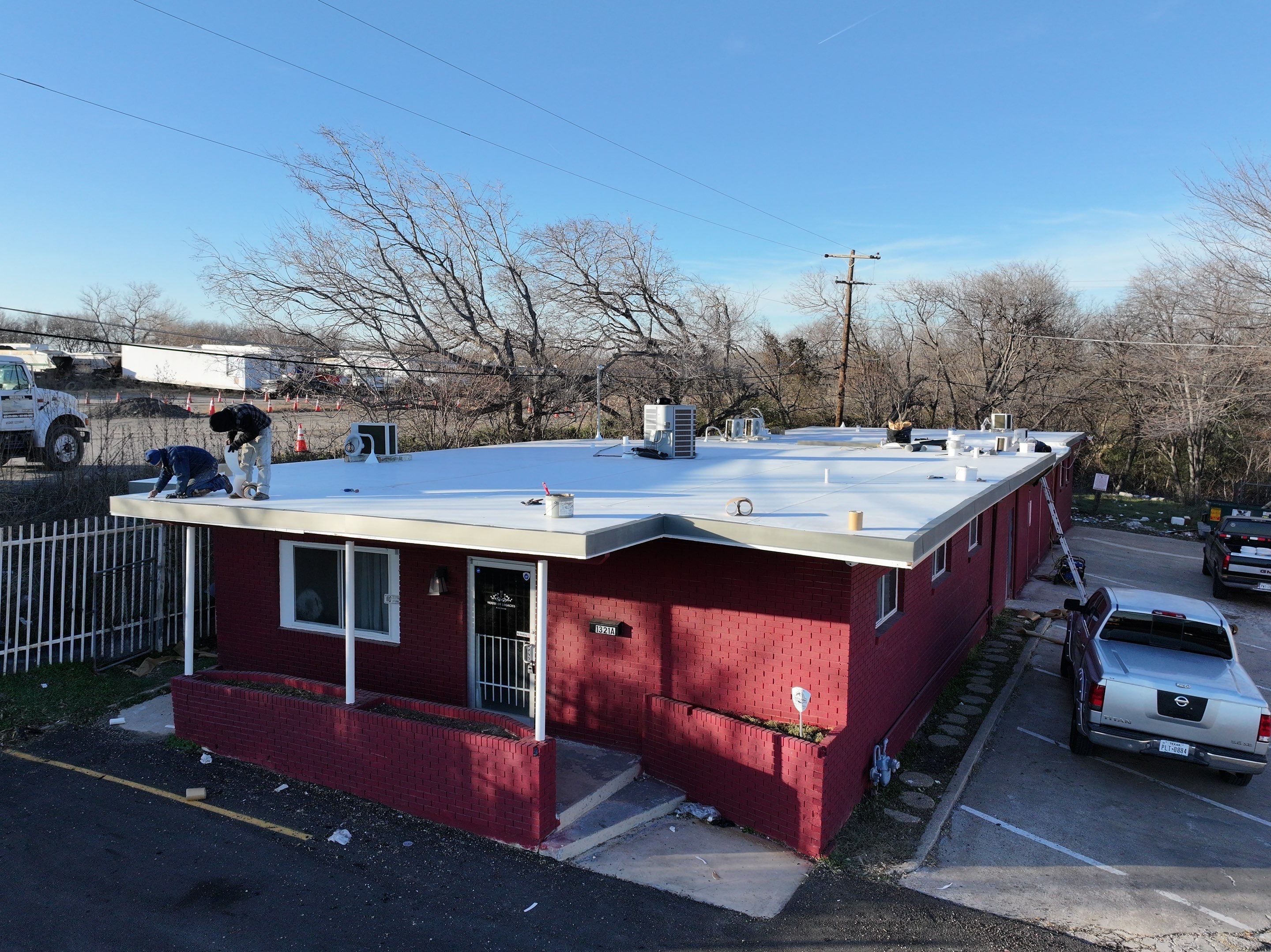 Commercial roofing overlay using GAF TPO over an old ballast roof by Becker Roofing and Exteriors
