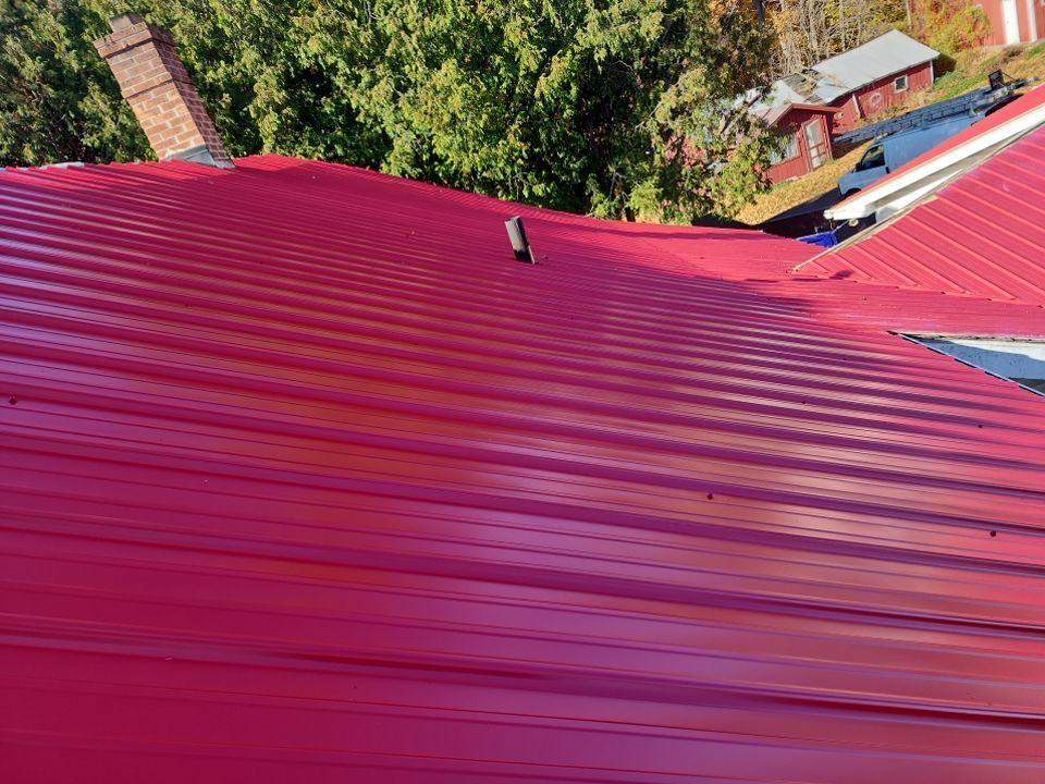 Residential Roof Installation with Red Pro Rib Metal Roofing in Adell, WI by Gellings Roofing and Siding LLC
