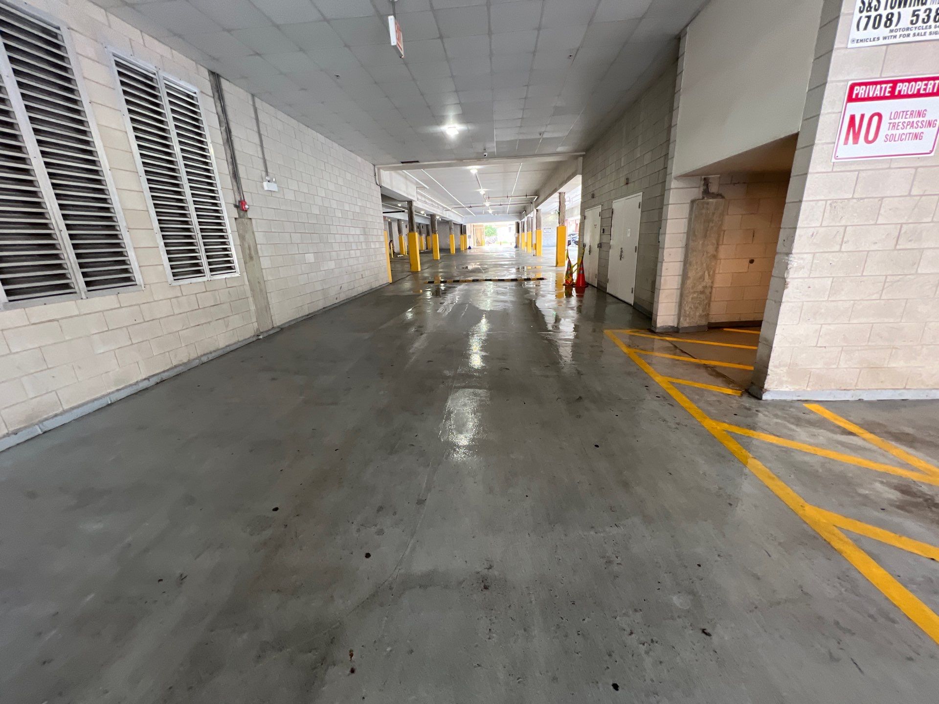 Parking garage using Hot water by Northern Power Washing LLC.