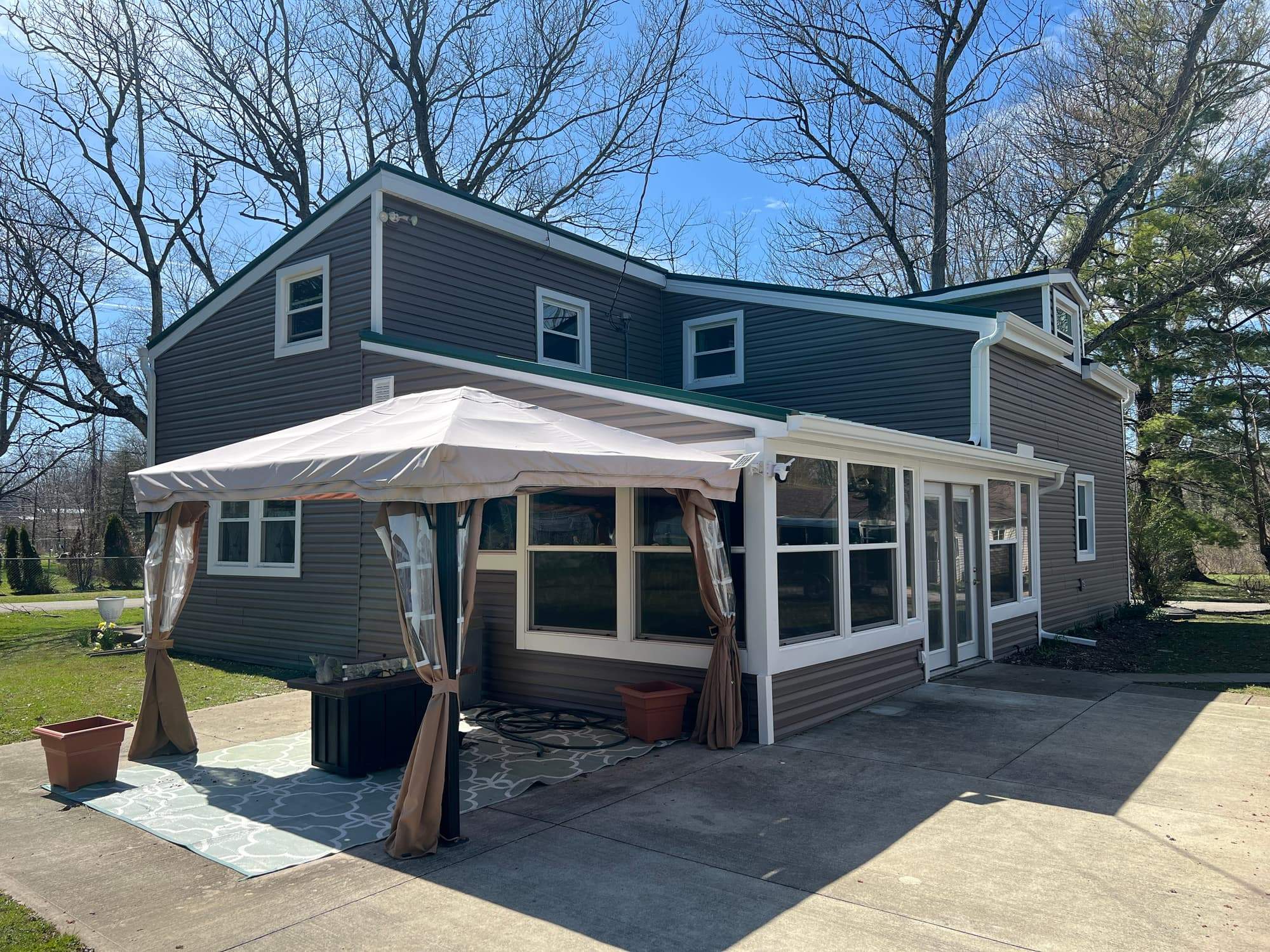 Green Metal Roof Installation and Exterior Renovation in Thornville by Canopy Contracting