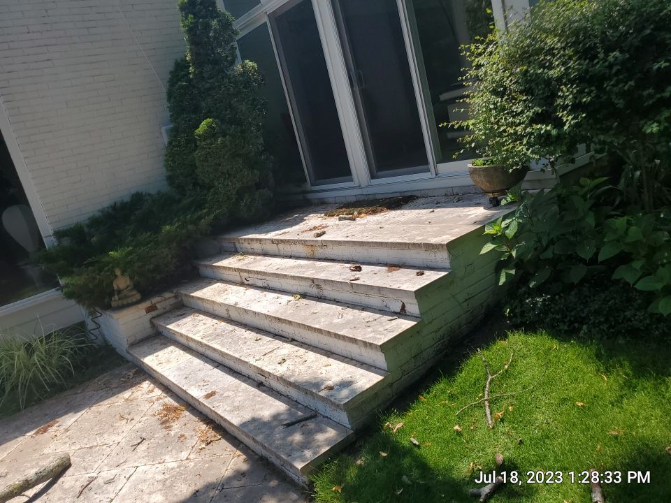 marble patio cleaning and sanding using Polysweep polymeric sand by Northern Power Washing LLC.