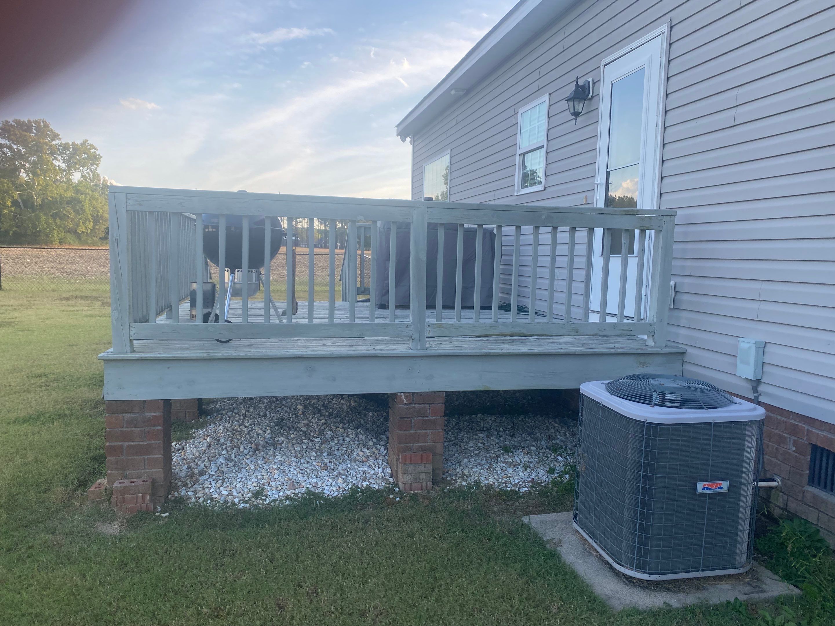 Pressure-Treated Wood Deck Resurface and Railing Replacement in Battleboro by The Remodeling Company