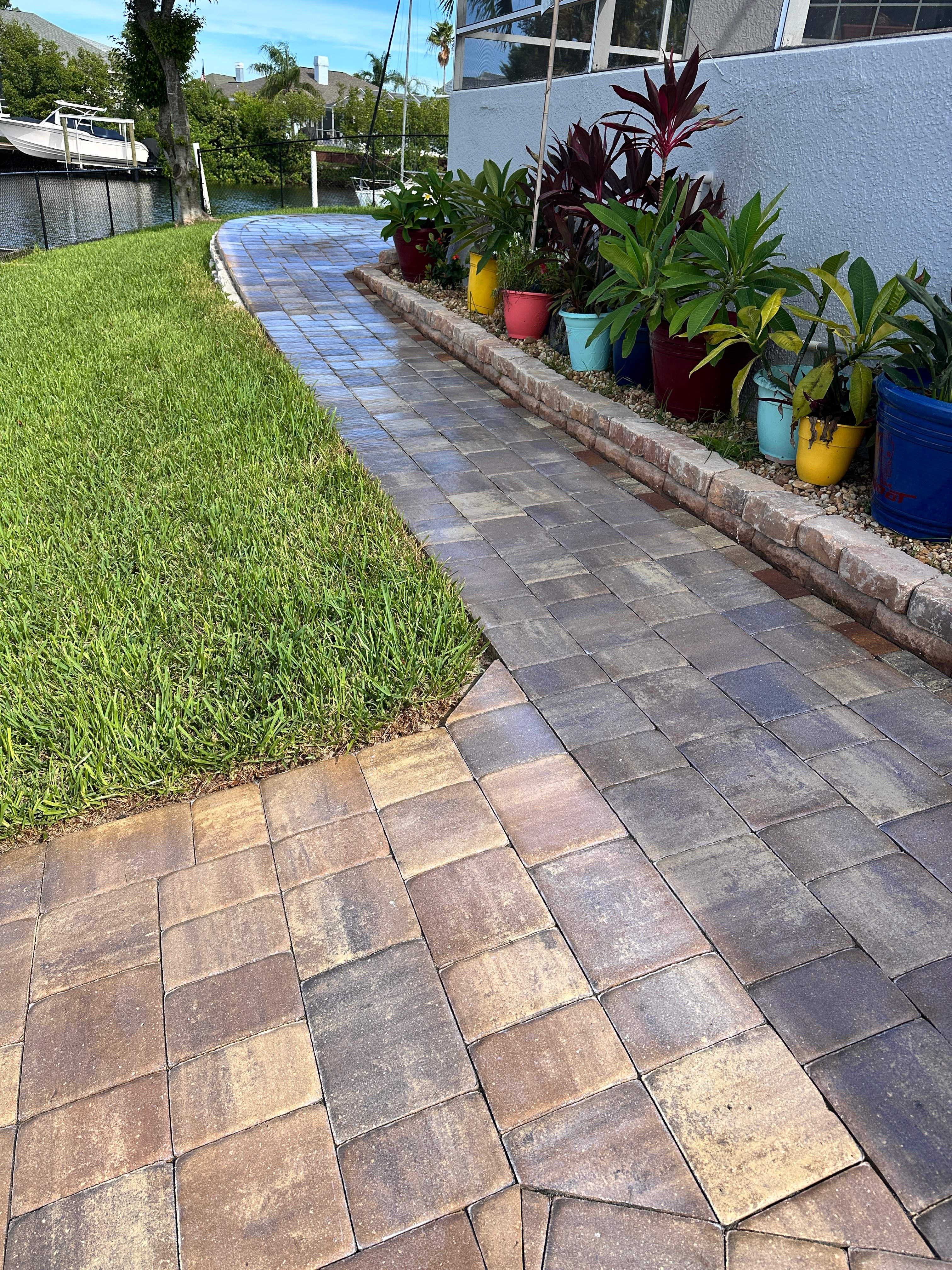 Travertine Sealing and Stripping for a Waterfront Pool Deck in Apollo Beach by Supreme Paver Experts
