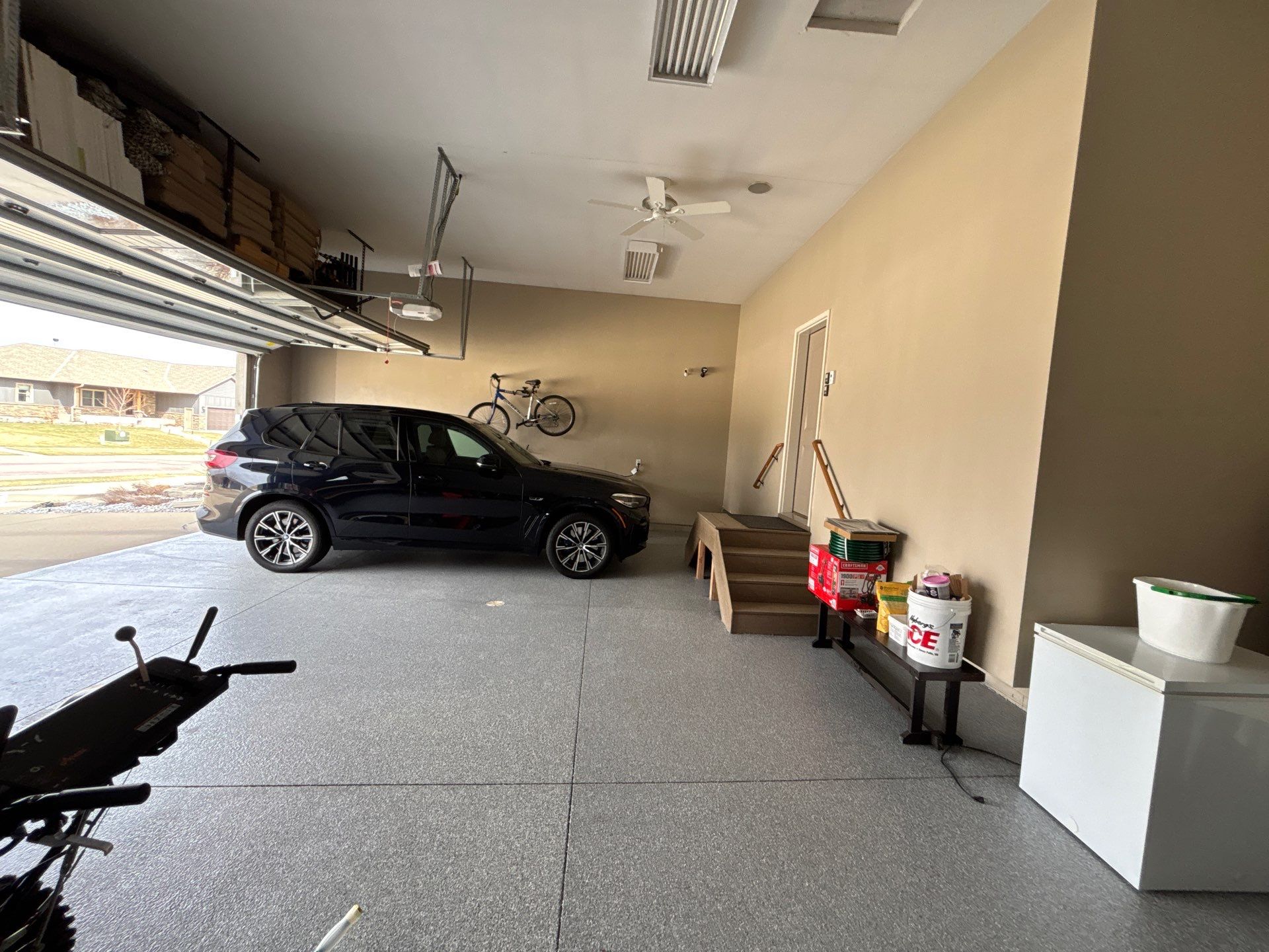 Speckled Grey Epoxy Garage Floor Coating Installation in Tea by Select Painting, Coatings & Garage Cabinets