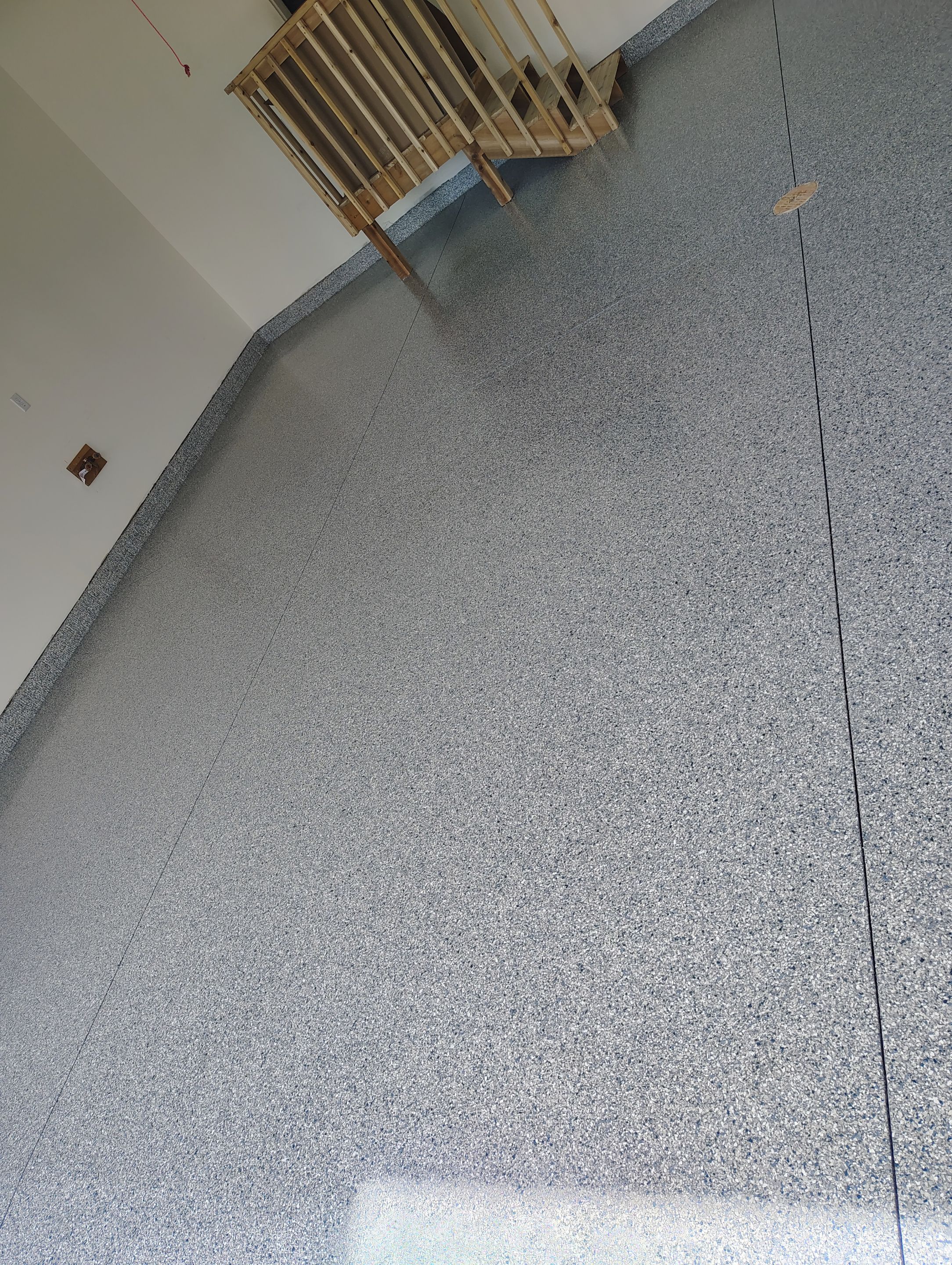 Sioux Falls Garage Floor Transformation with Gray Decorative Flake Coating by Select Painting, Coatings & Garage Cabinets