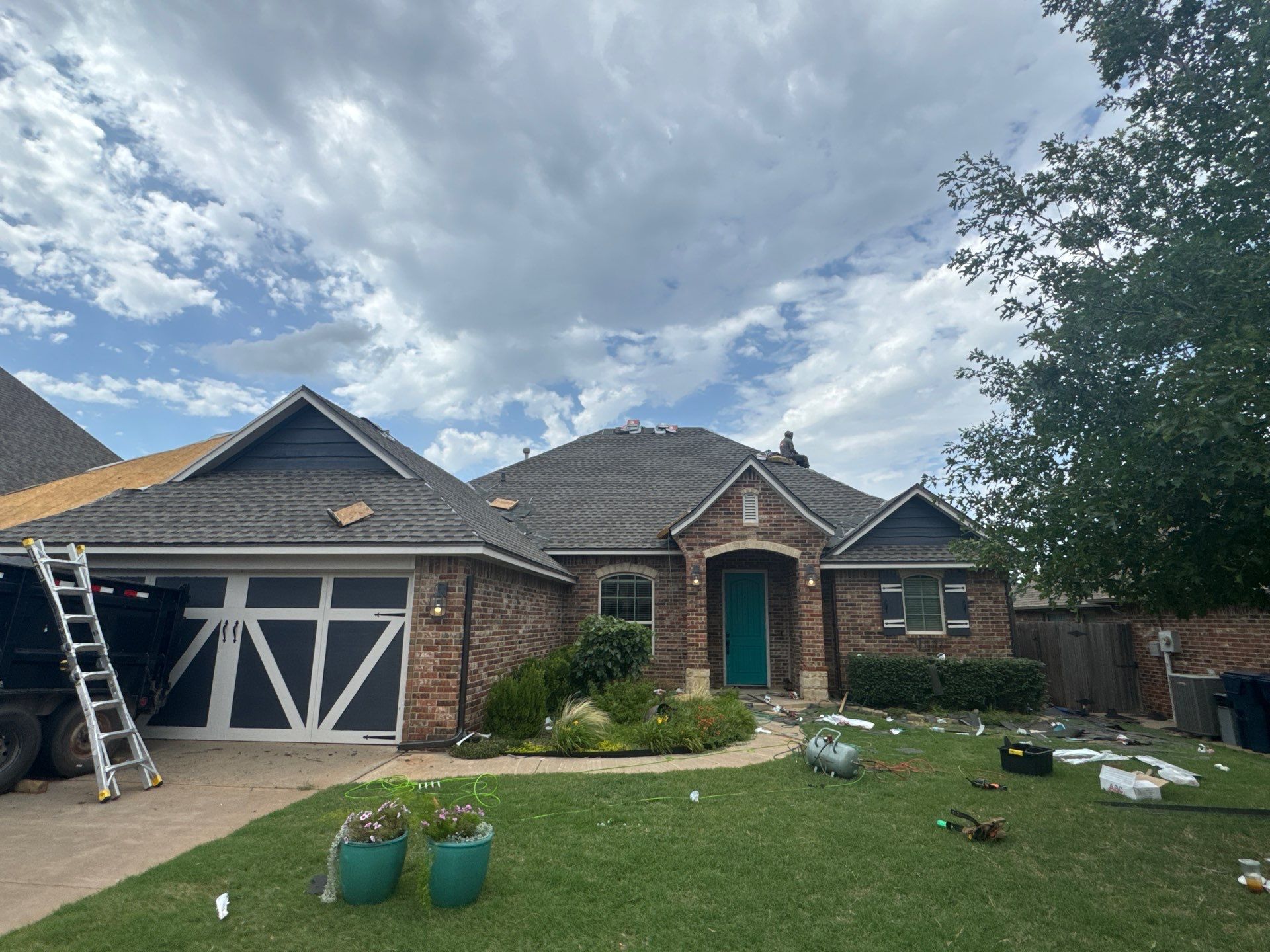 GAF Architectural Shingle Roof Replacement and Decking Repair in Mustang by 5Coat Roofing & Construction