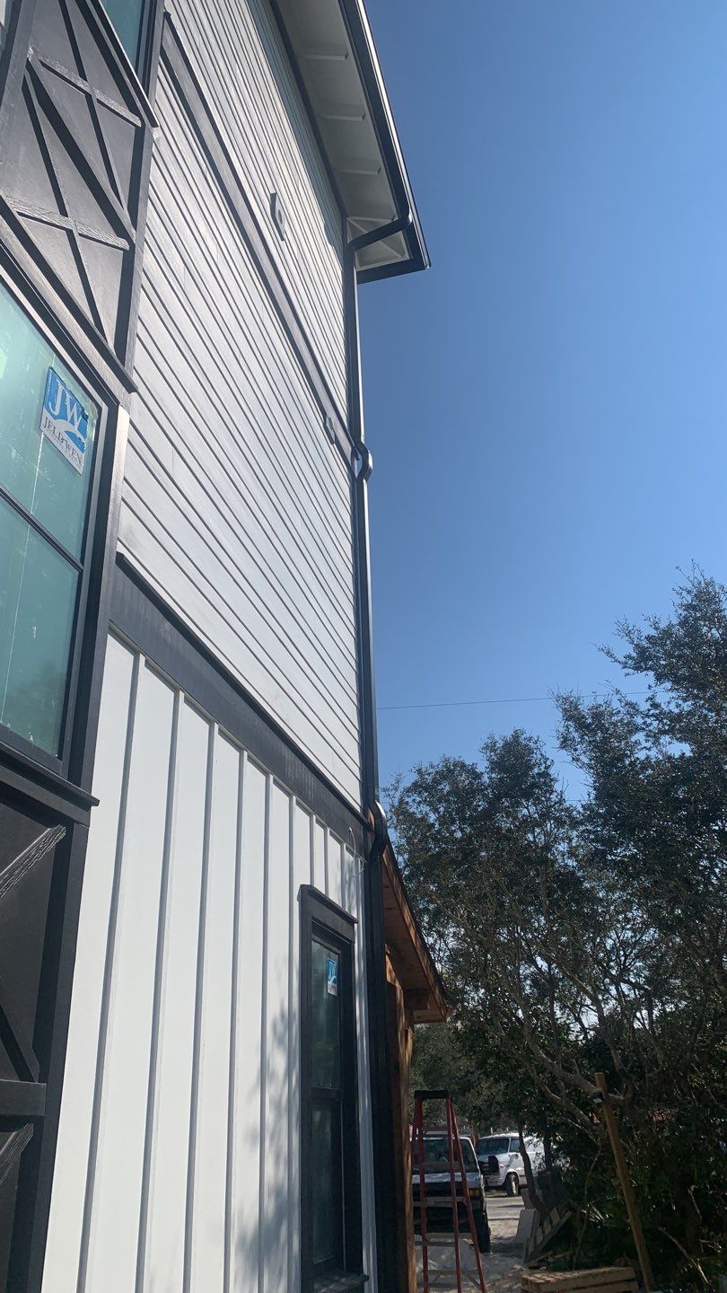 Seamless Gutter Installation Using Black Half Round Seamless Gutters by Gutter Professors