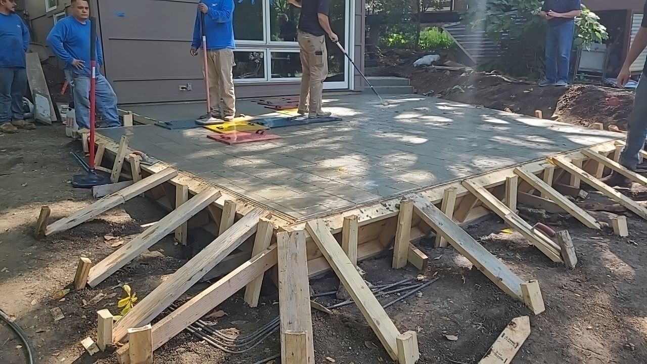 Back Yard Cantilivered Patio by LAND ESCAPES LLC