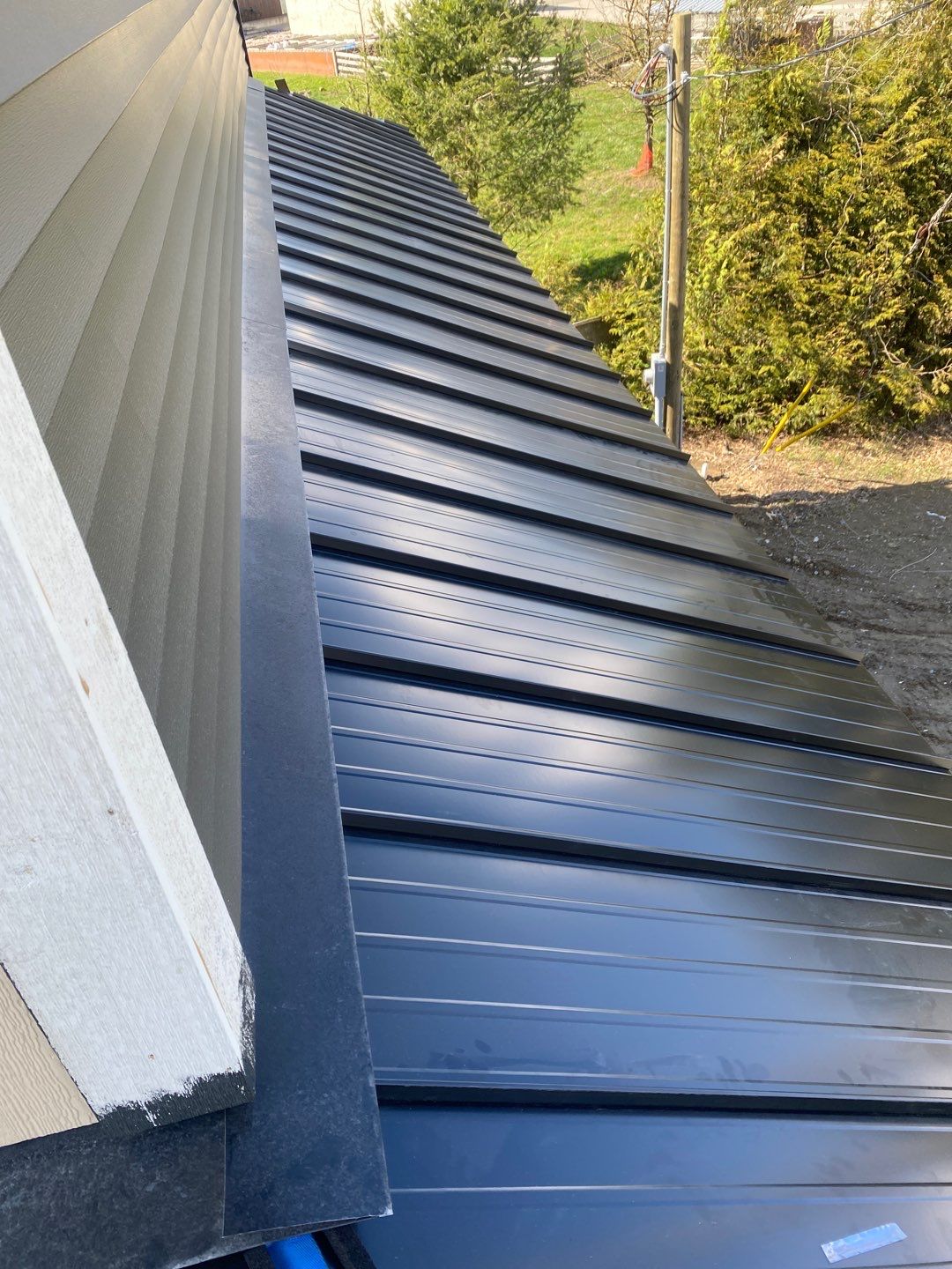 Residential Roofing Installation using 16" Prolok metal and Owens corning shingles by Top Notch Roofing Inc