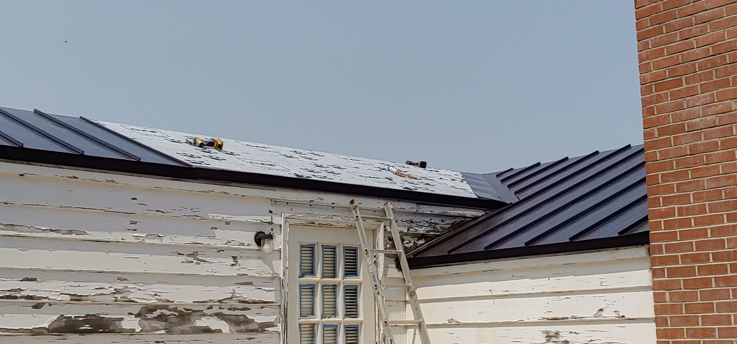 Residential Roofing Installation using Standing seam metal roofing system by Straight Edge Roofing Inc
