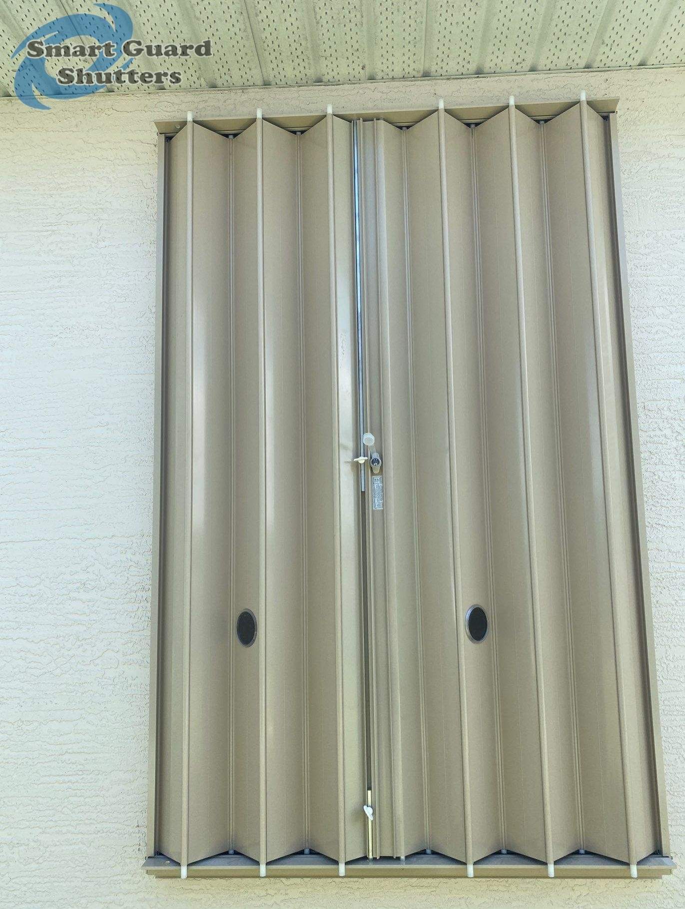 Accordion Shutters in Beige  by Smart Guard Shutters