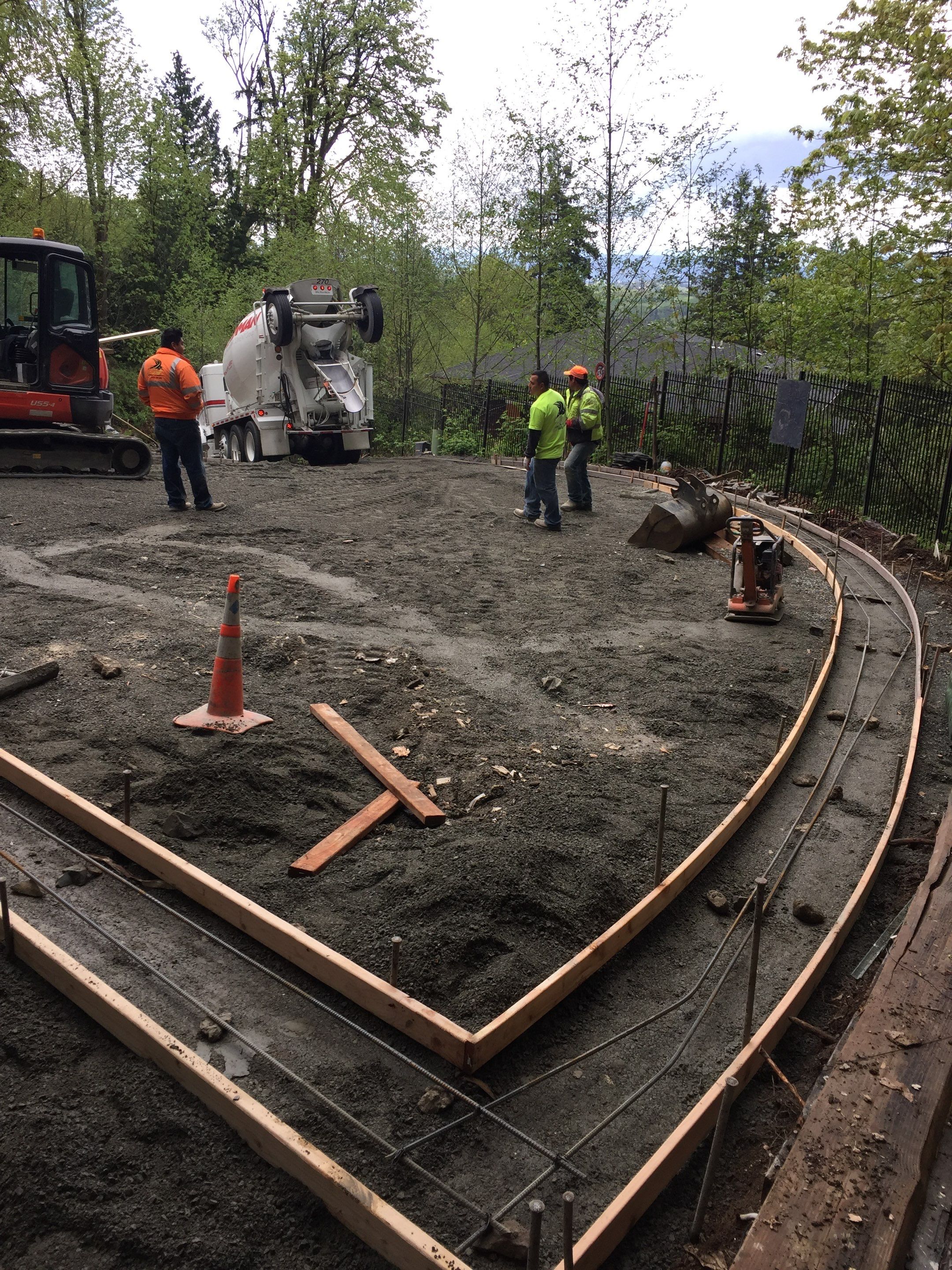 Asphalt Driveway and Stamped Concrete Patio Finish  by Jireh Asphalt & Concrete Inc 