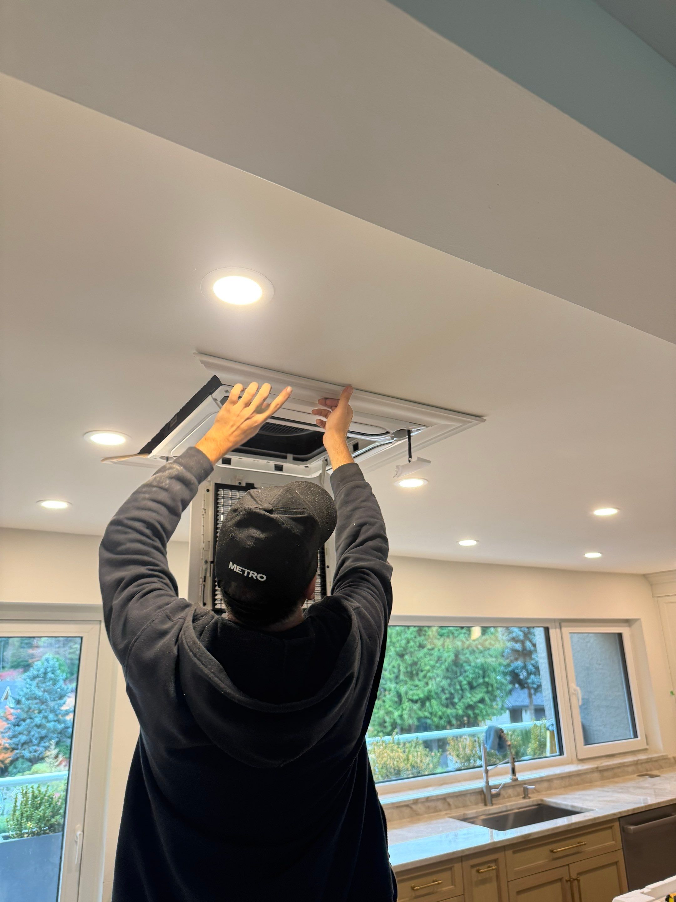 West Vancouver Custom Millwork: Heat Pump Trim & Window Finishing by YVR Construction Group