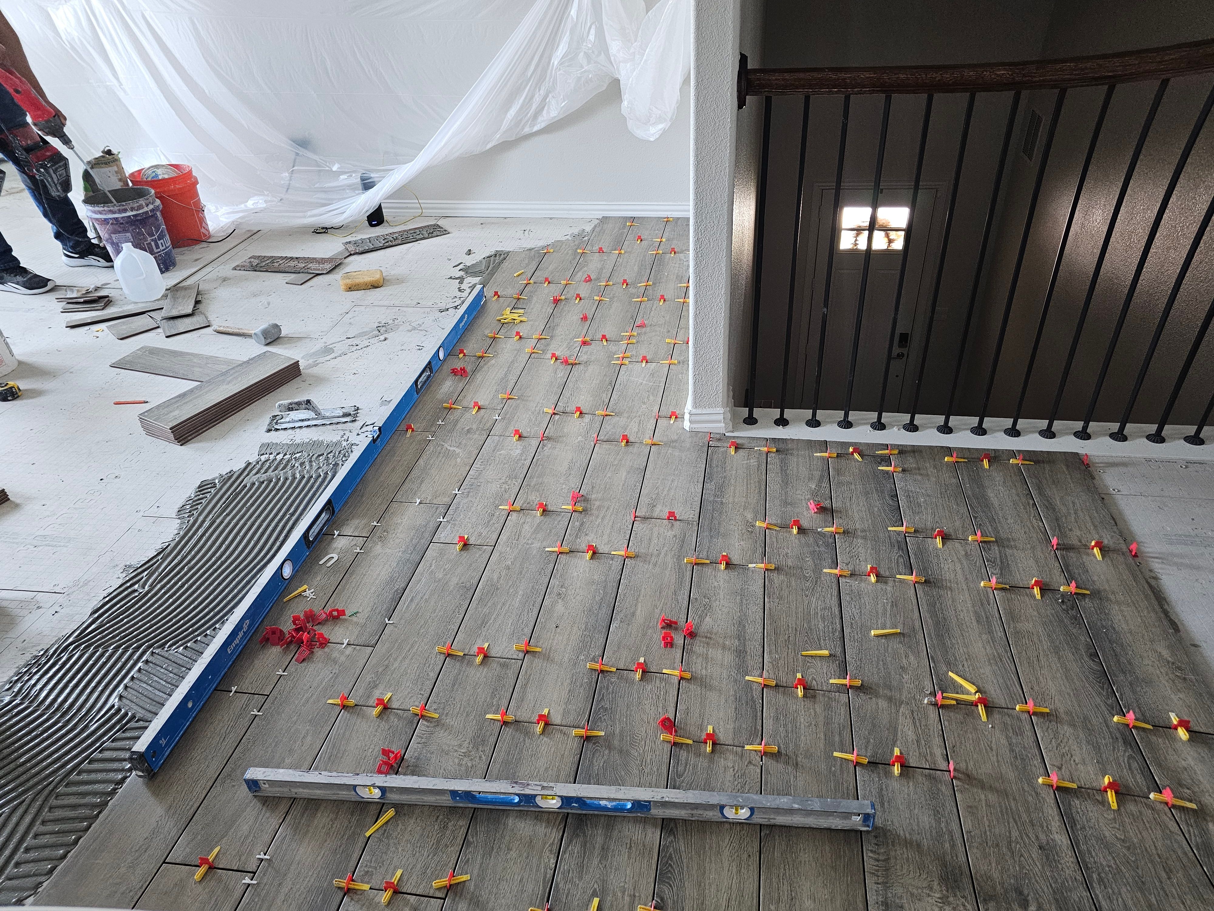 Carpet replacement with Tile and Red Oak Stairs by EL-GC LLC 