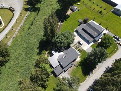 Residential Roofing Installation using 12" Prolok metal, shingles and Torch on roofing