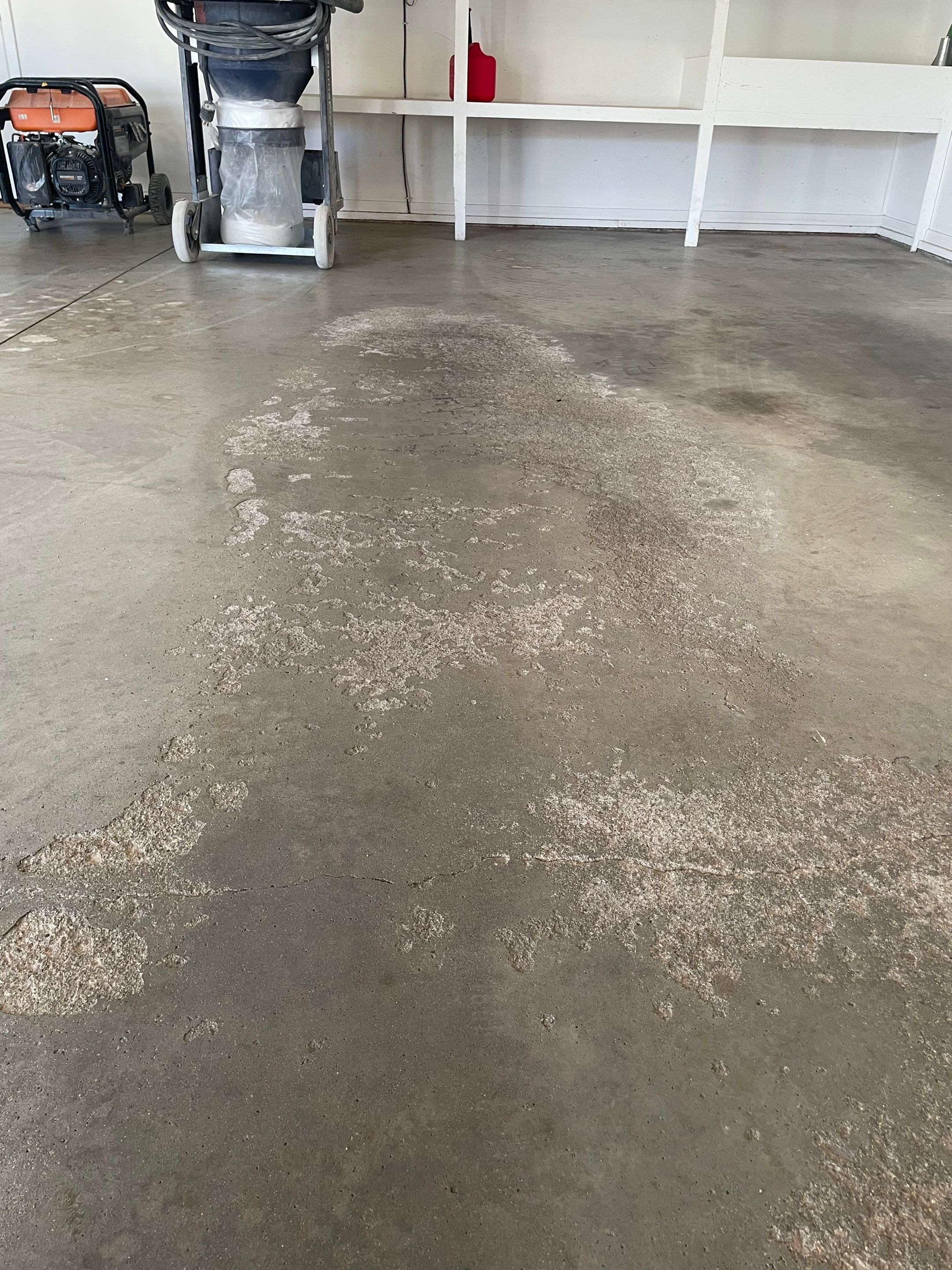 Yankton Garage Floor Restoration with Gray Speckled Epoxy Coating by Select Painting, Coatings & Garage Cabinets
