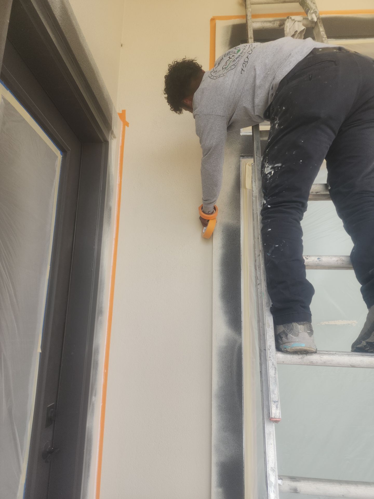 Castle Rock Elegance: White Stucco Exterior with Bold Tricorn Black by J&M Painting LLC