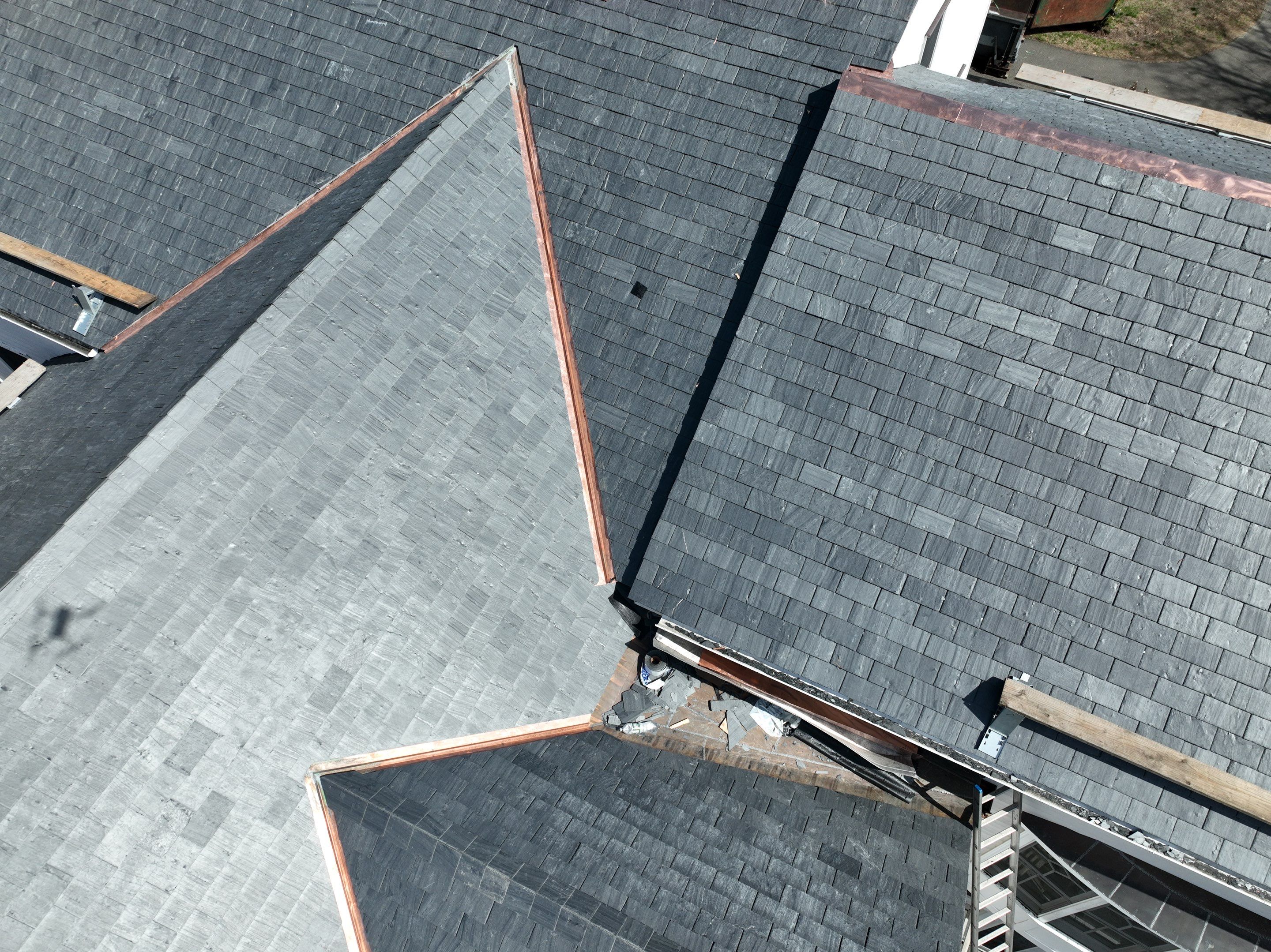 Residential Roofing Installation using Vermont Slate by A Plus Exterior