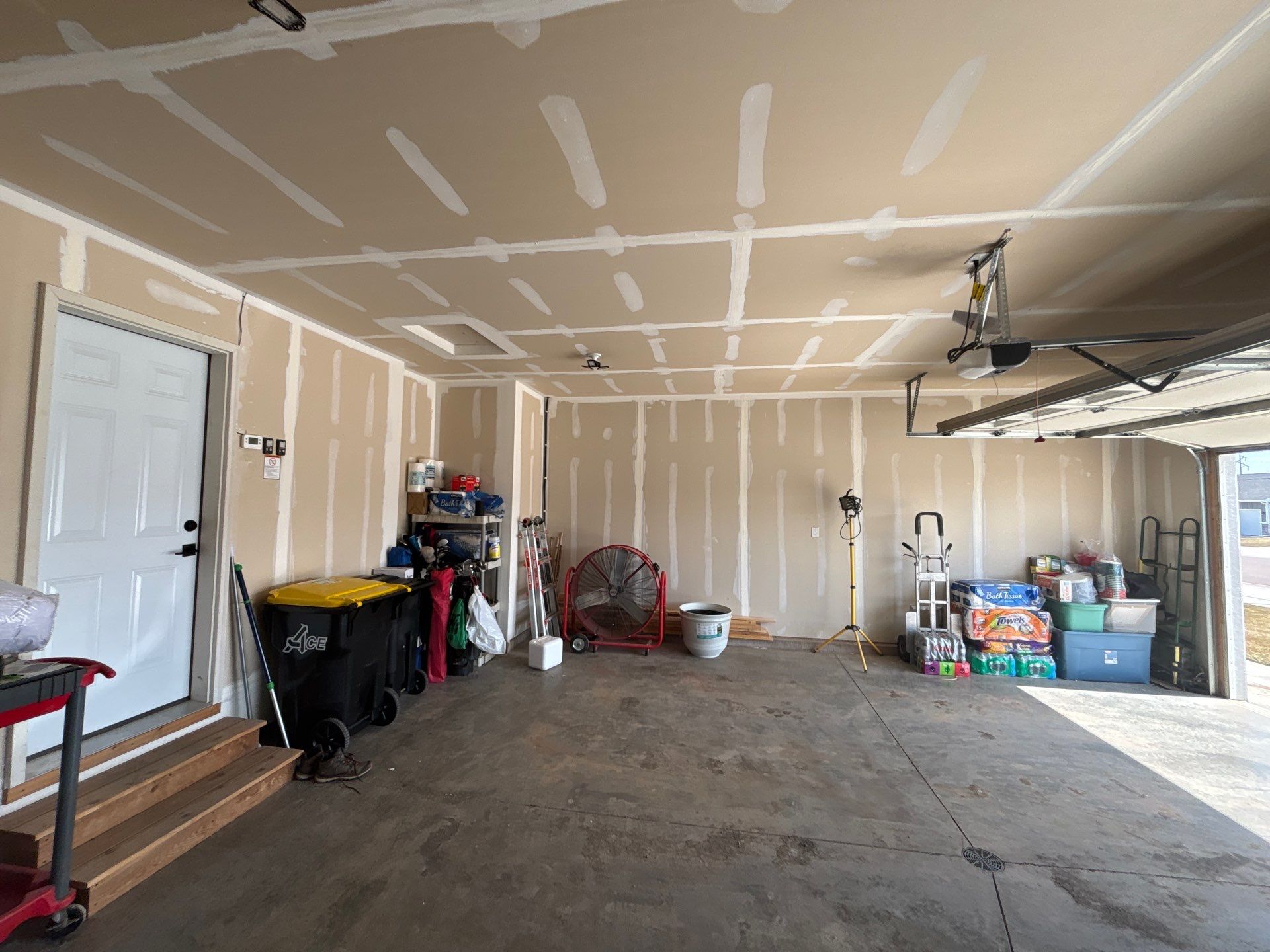 Grey Flake Epoxy Garage Floor Coating in Sioux Falls by Select Painting, Coatings & Garage Cabinets