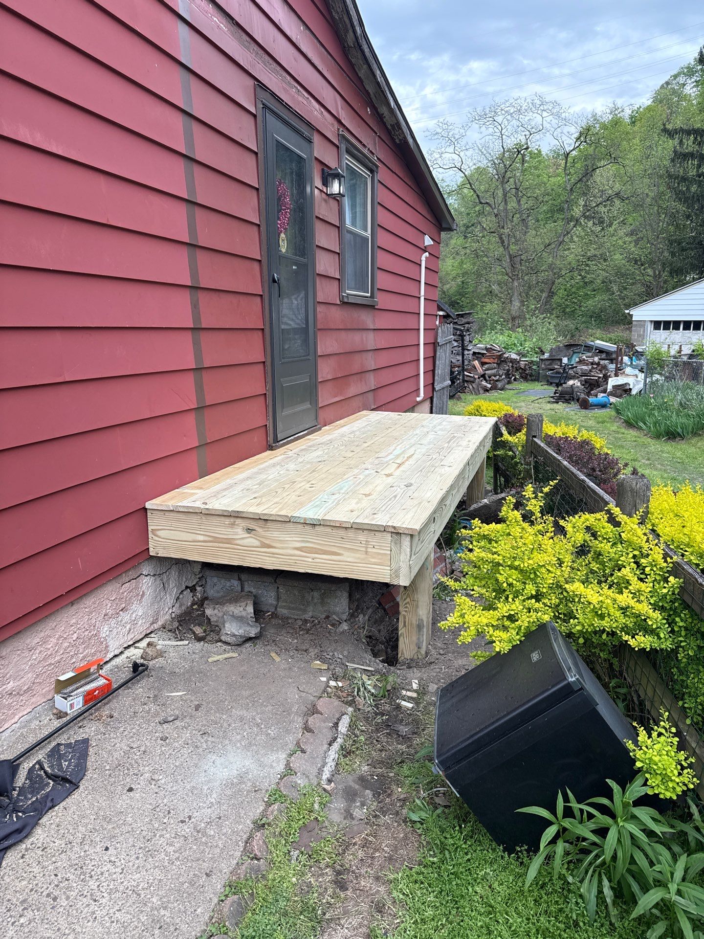 Roof sunspace deck  by Cousins Roofing Siding & Decks