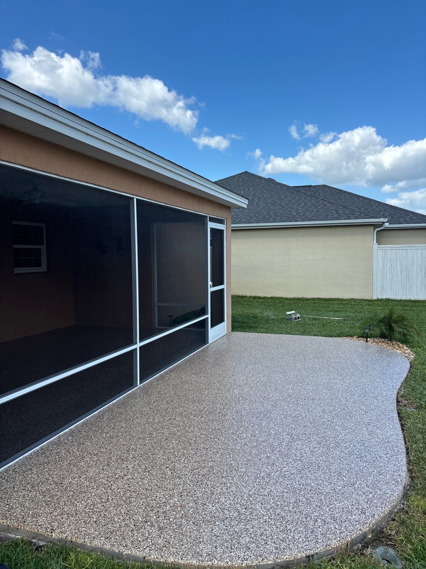 Garage and Lanai With Exterior Pad in Sandstone  by Innovative Concrete Coatings 