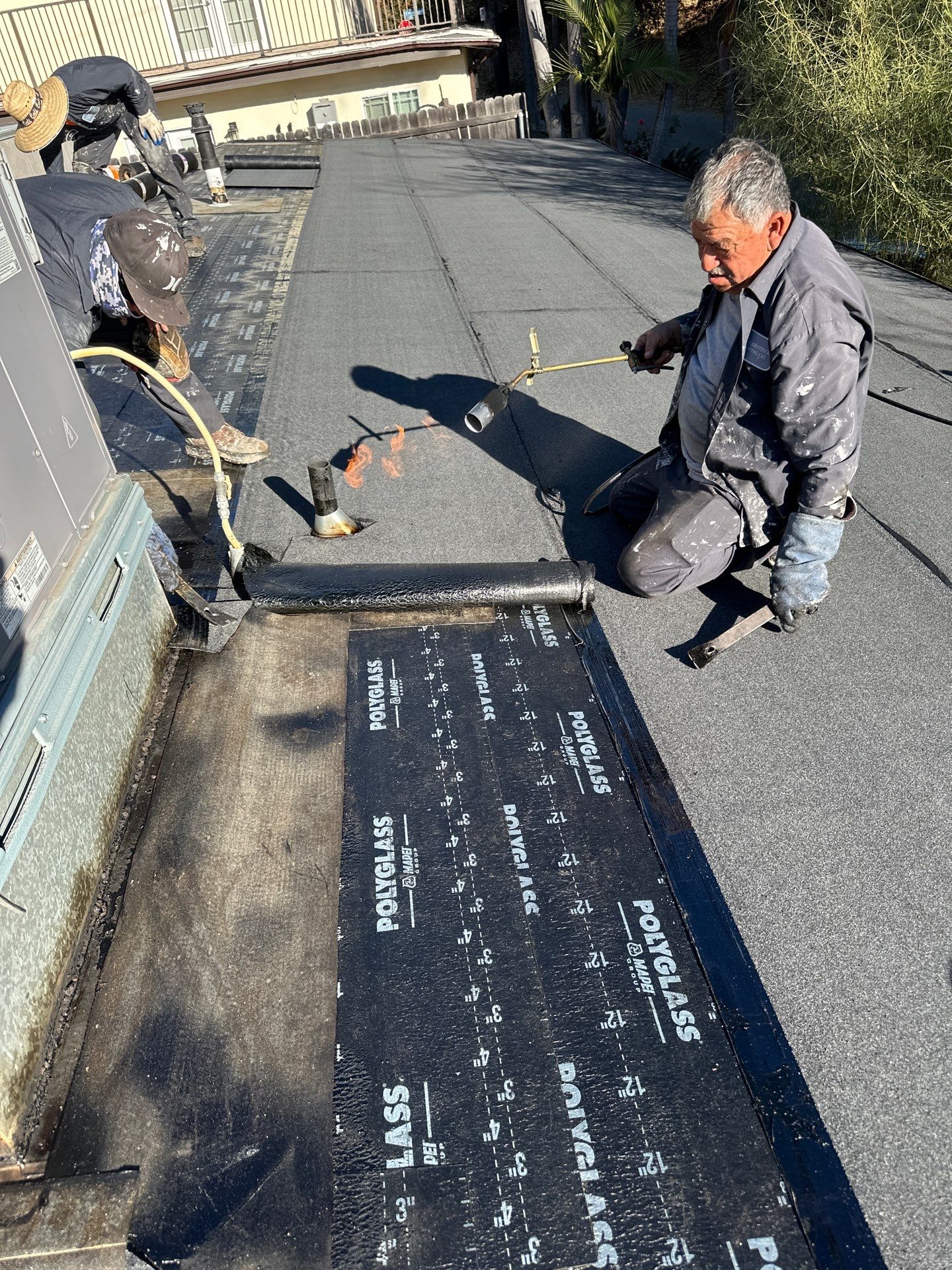 Residential Roofing Installation using Polyfresko® G Highly Reflective Modified Bitumen Cap Sheet by Hull Brothers Roofing