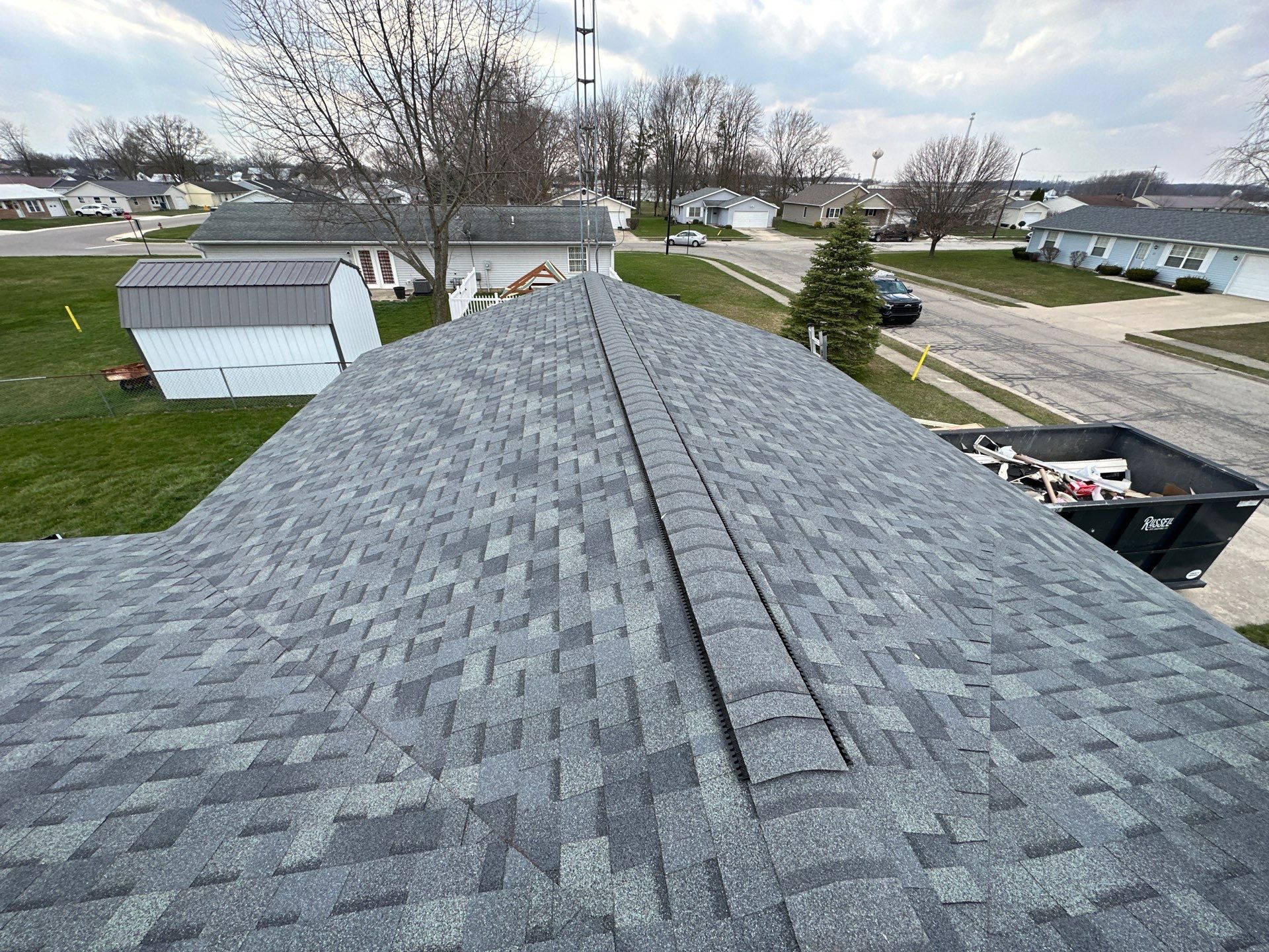 Storm Damage Residential Roof and Siding Installation by WIW Enterprises Inc