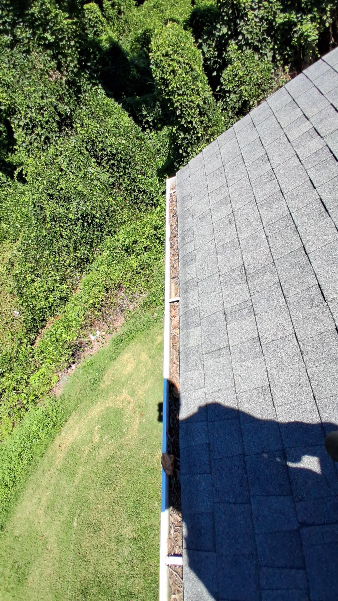 Commercial gutter cleaning Mooresville & Lake Norman, NC before photo with filled gutters