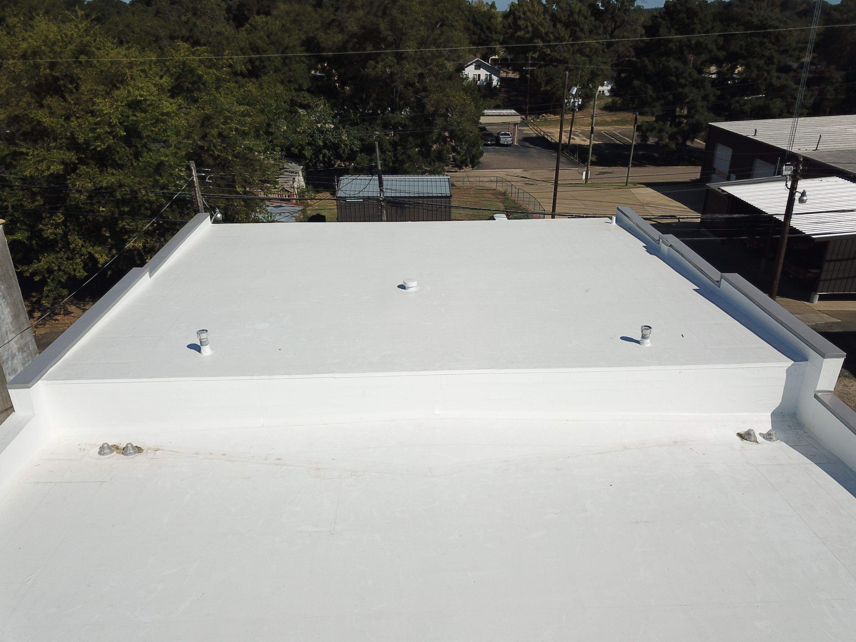 Commercial Roofing Installation in DeQueen, AR, using 50 mil PVC by Hostetler Roofing