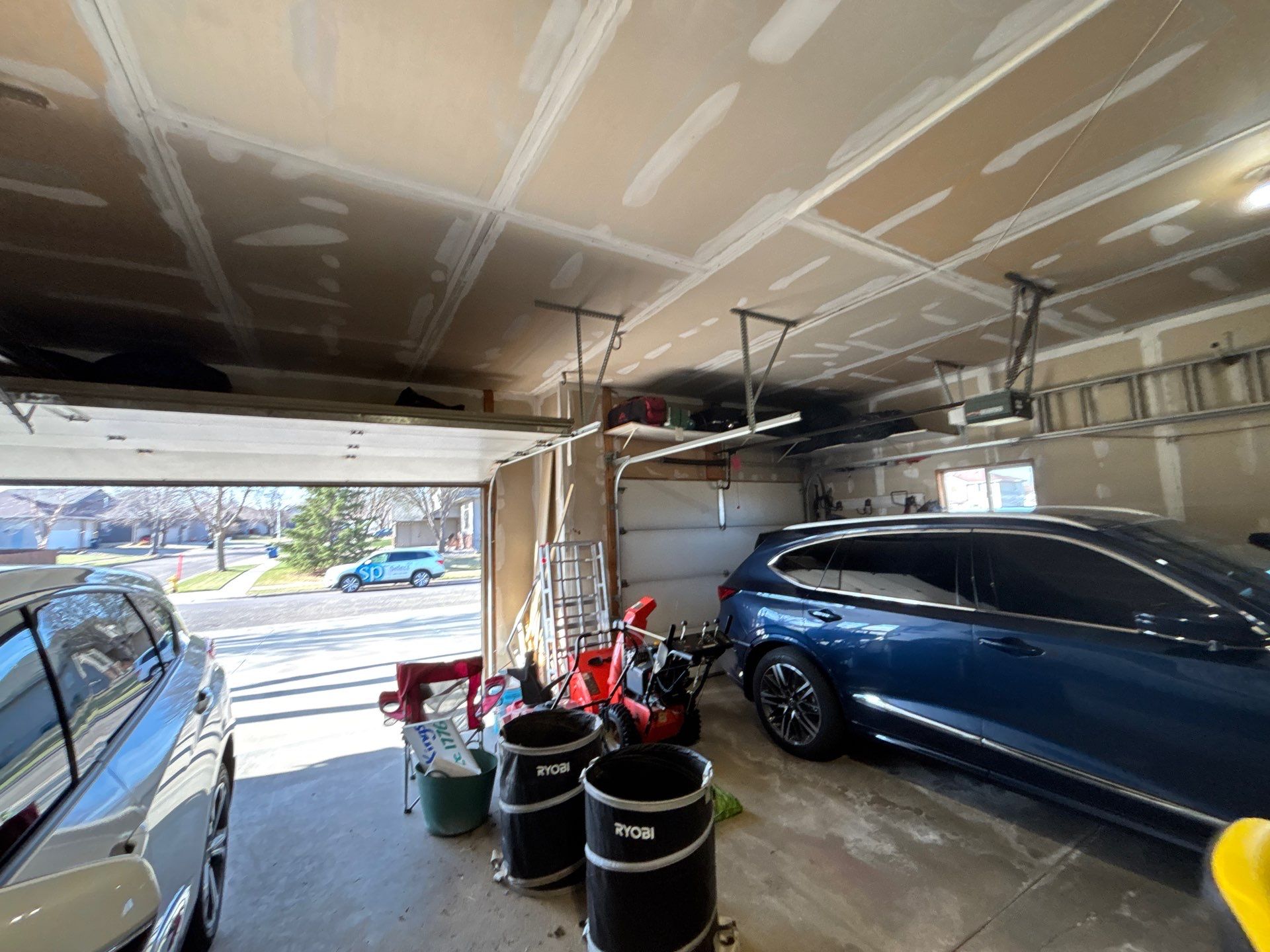 Sioux Falls Garage Concrete Repair and Epoxy Flake Floor Coating by Select Painting, Coatings & Garage Cabinets