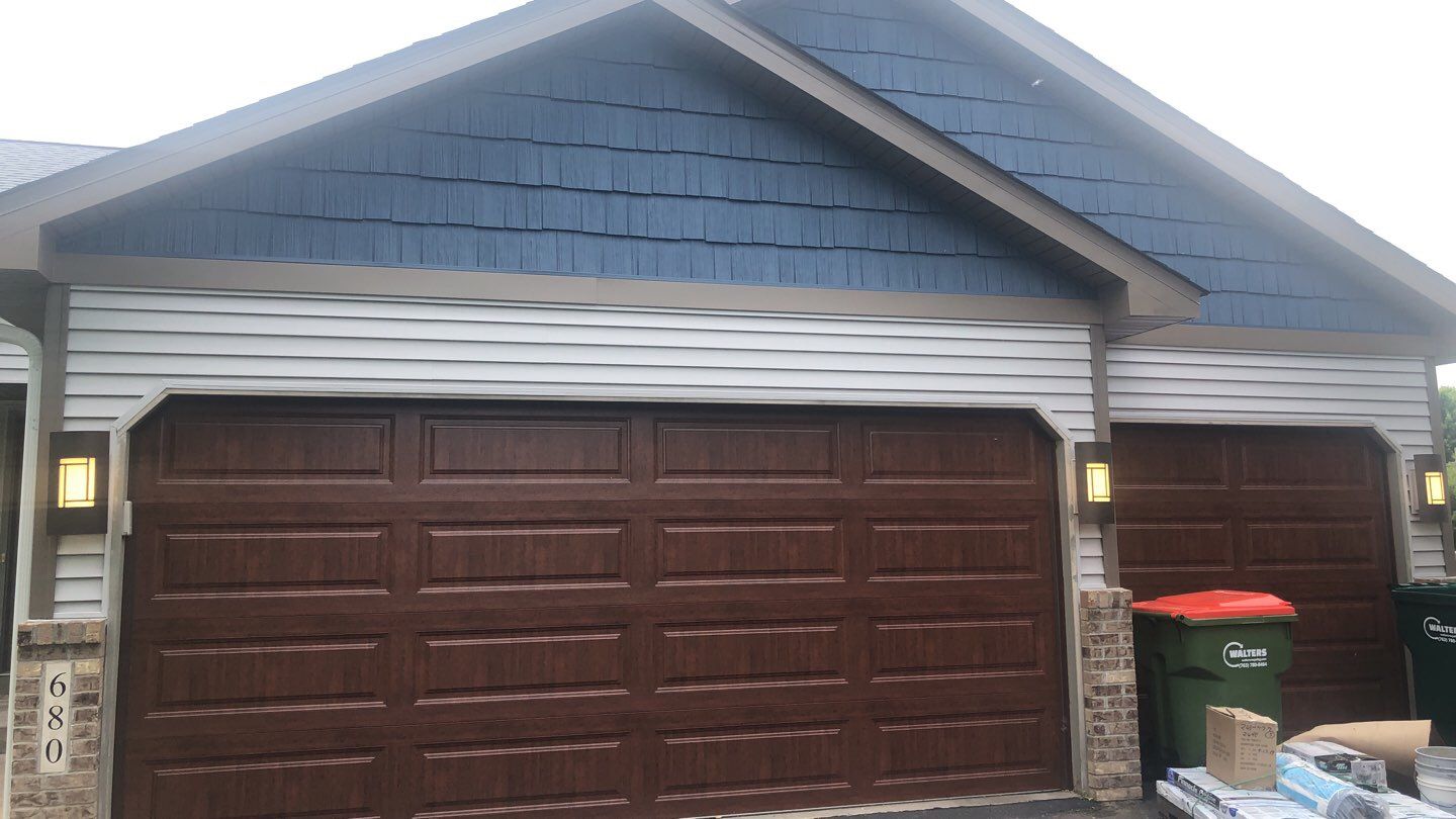 Storm Damage Restoration using Atlas Pinnacle Shingles and Mastic Vinyl Siding  by MODERN EXTERIOR SYSTEMS