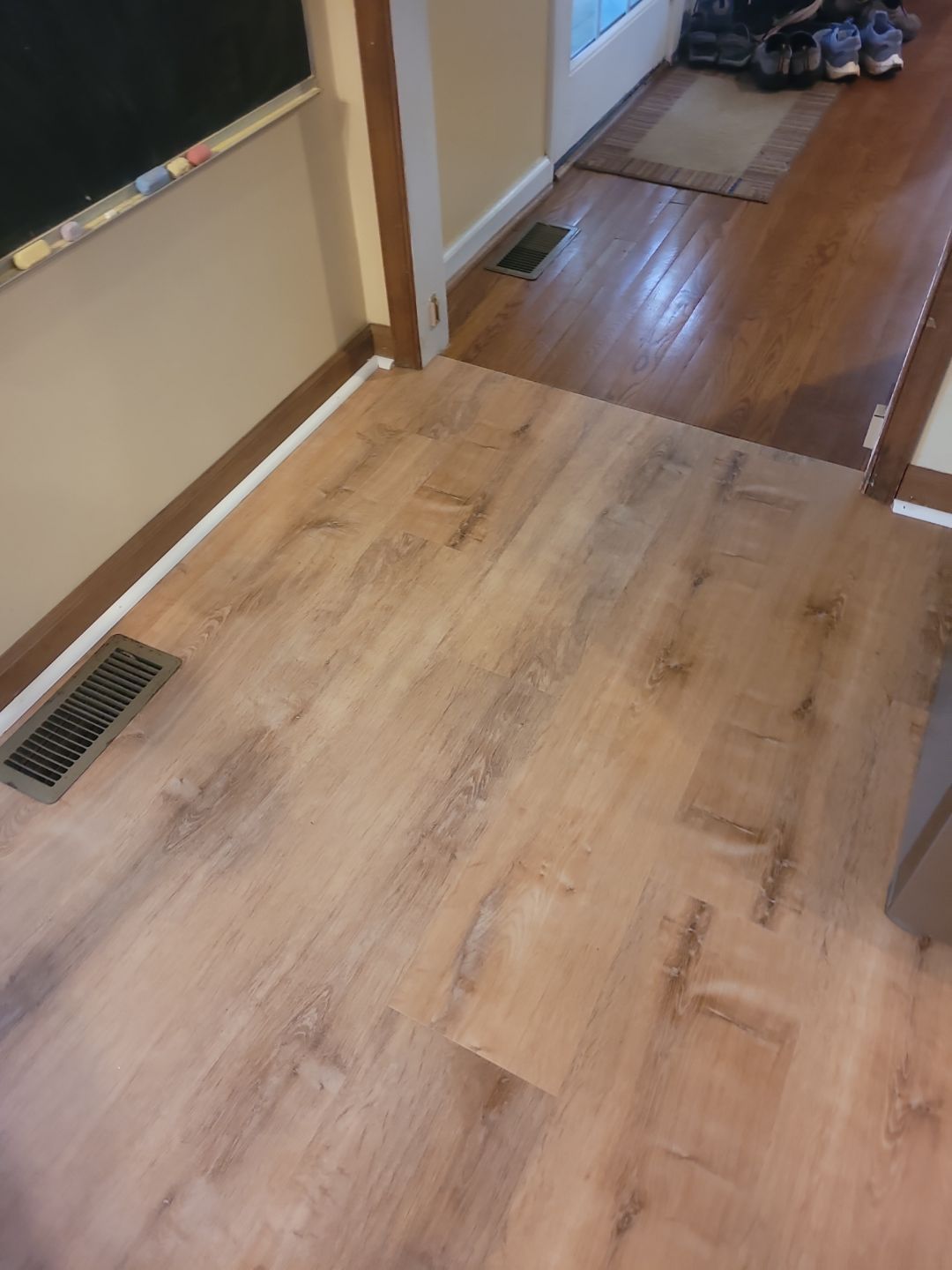 A Pathway to Personality – A Two-Tone Kitchen Transformation in Apex by Elite Remodeling and Design LLC